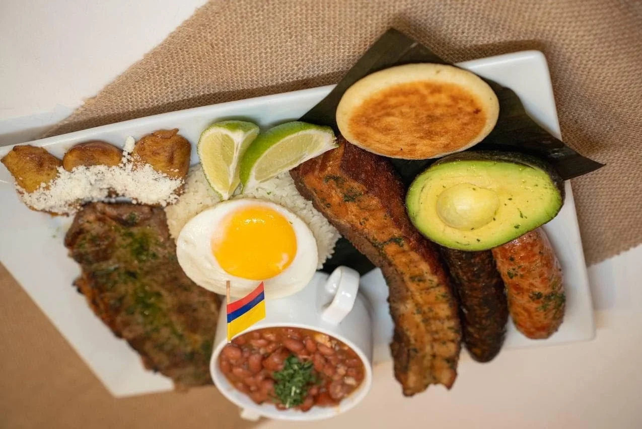 Colombian bandeja paisa with assorted meats and sides