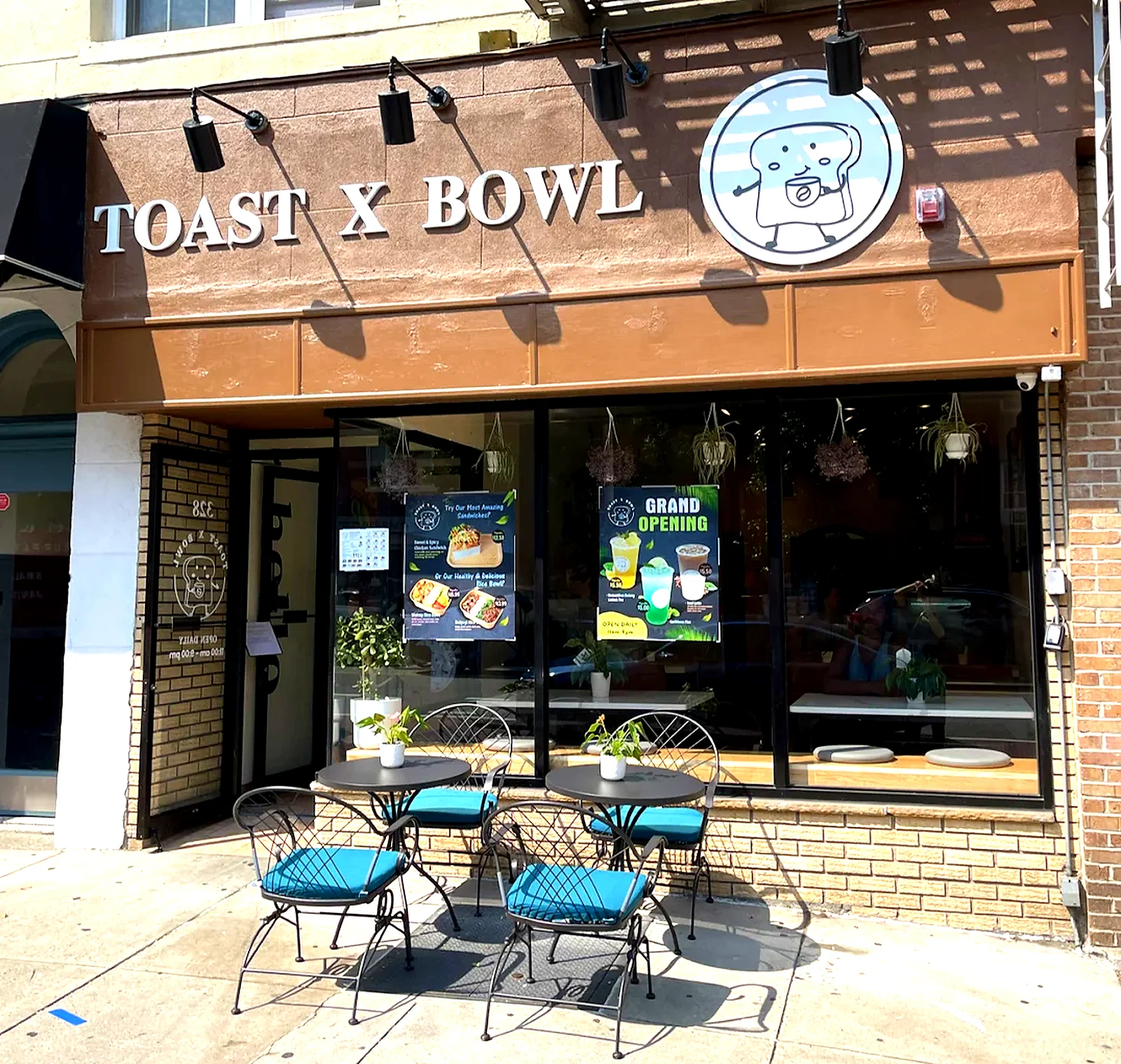 Exterior of Toast X Bowl restaurant with outdoor seating