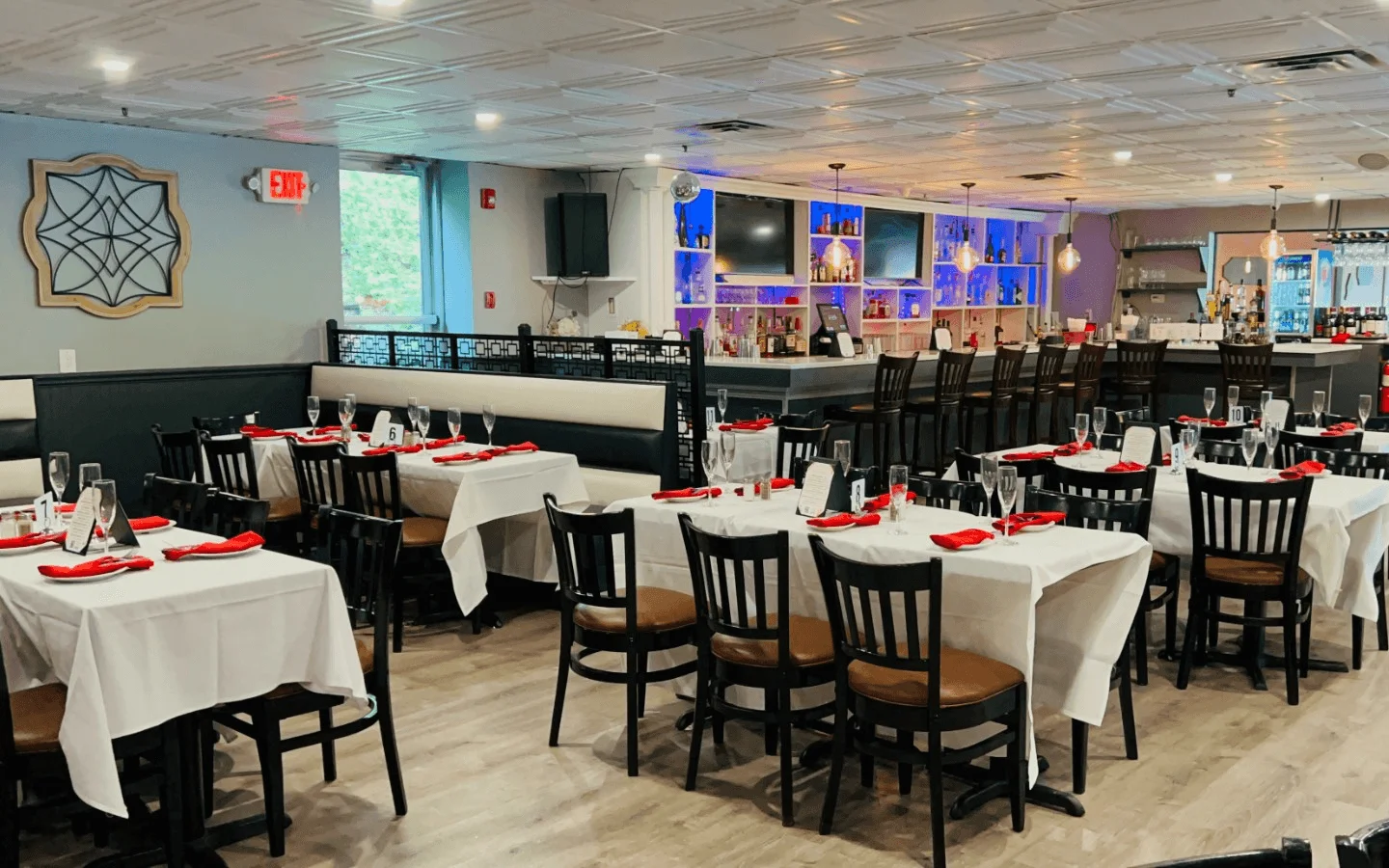 Elegant restaurant interior with tables and bar area