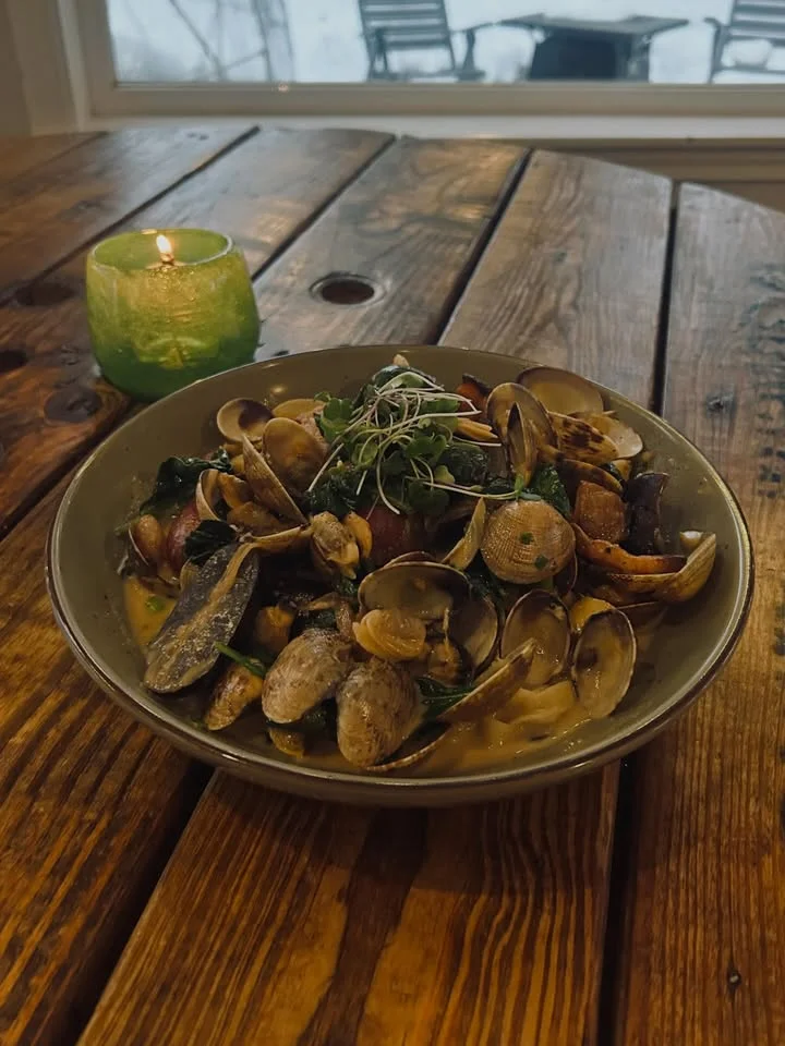Bowl of Italian clam pasta with fresh herbs