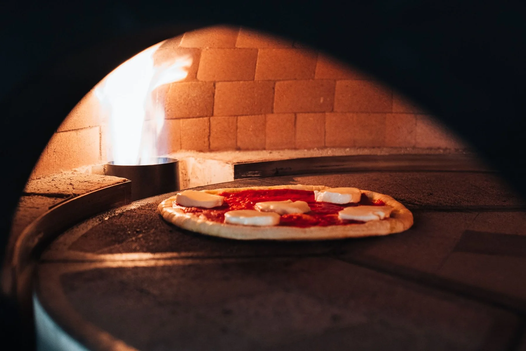 Pizza baking in the Marra Forni stone oven at Firetender in Manteo NC