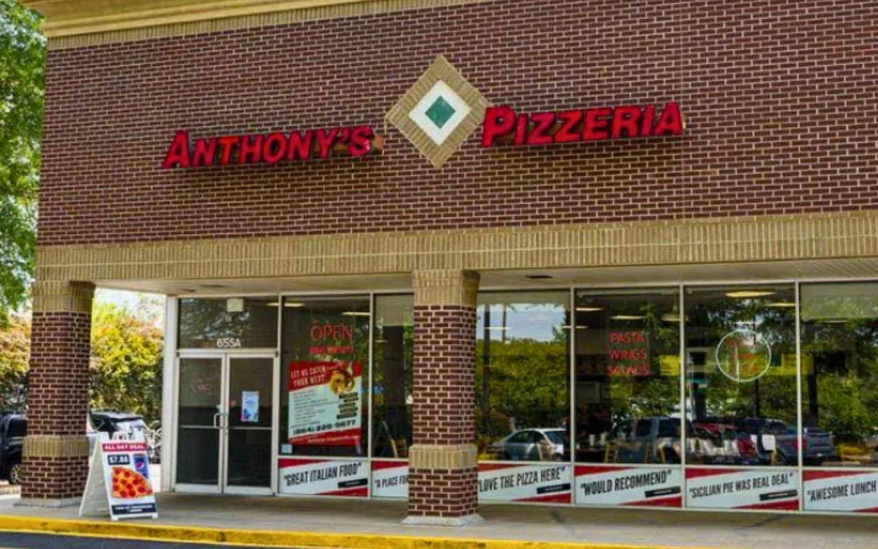 Exterior view of Anthony's Pizzeria with signage and outdoor seating