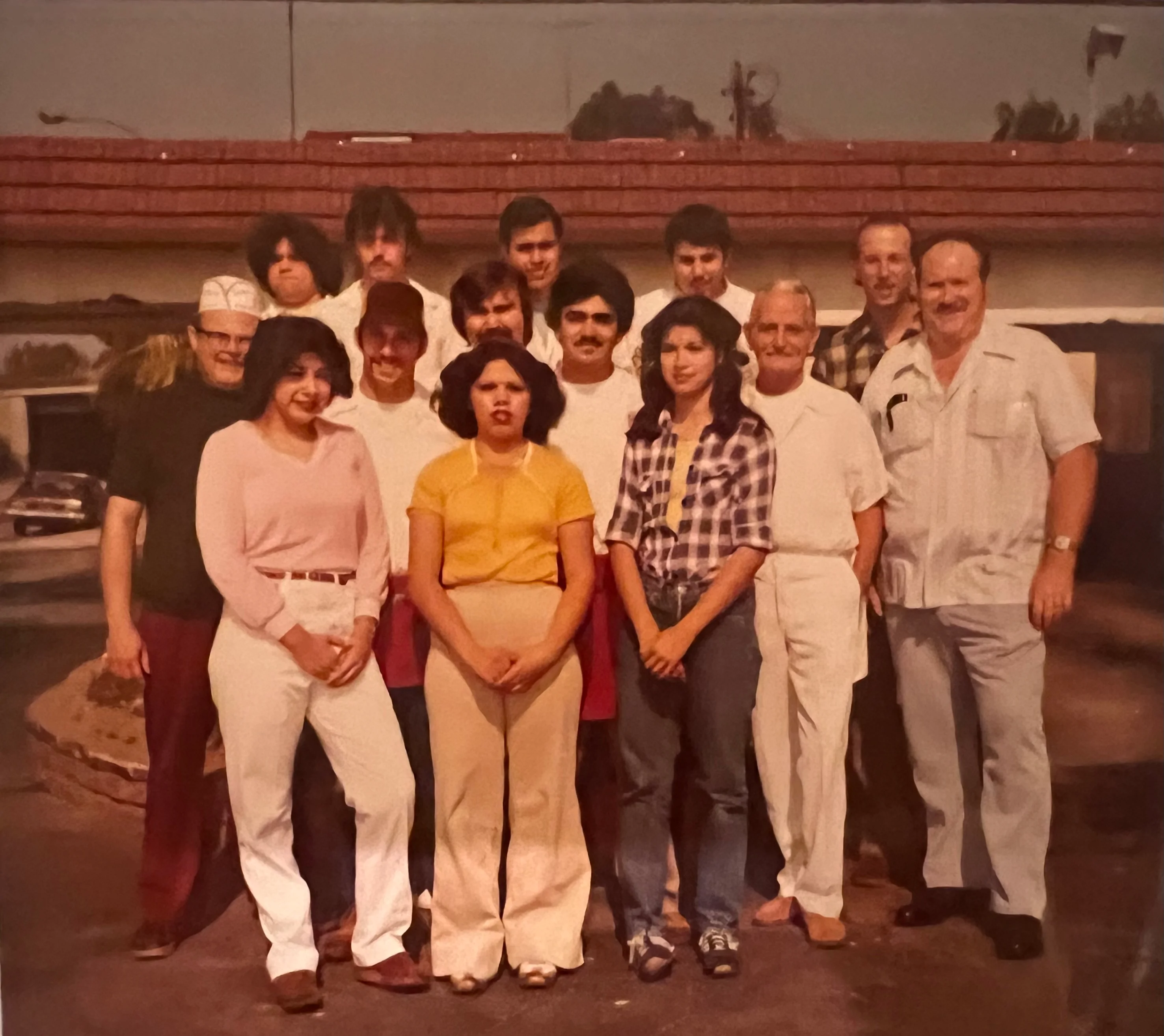 Group photo of restaurant staff in a vintage setting