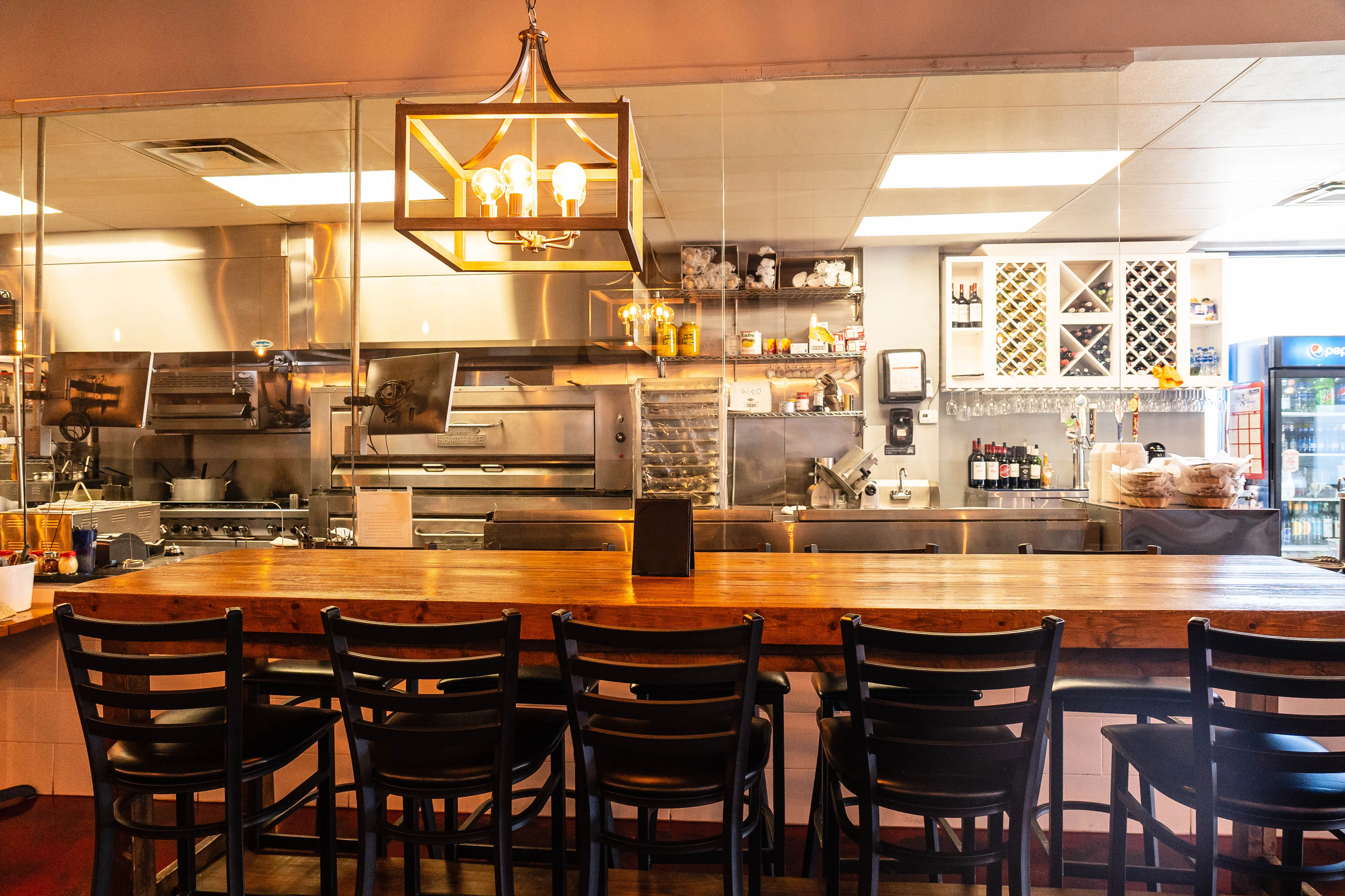 Cozy restaurant interior with a view of the open kitchen