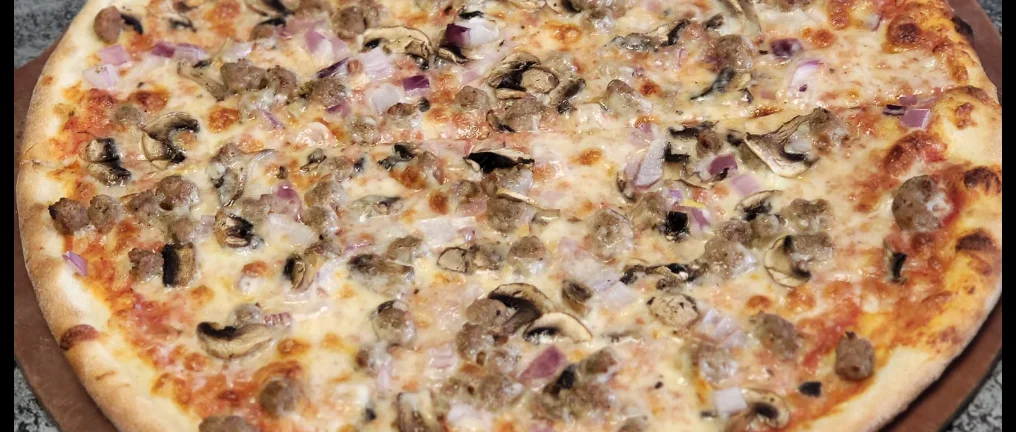 Classic Italian sausage pizza with mushrooms