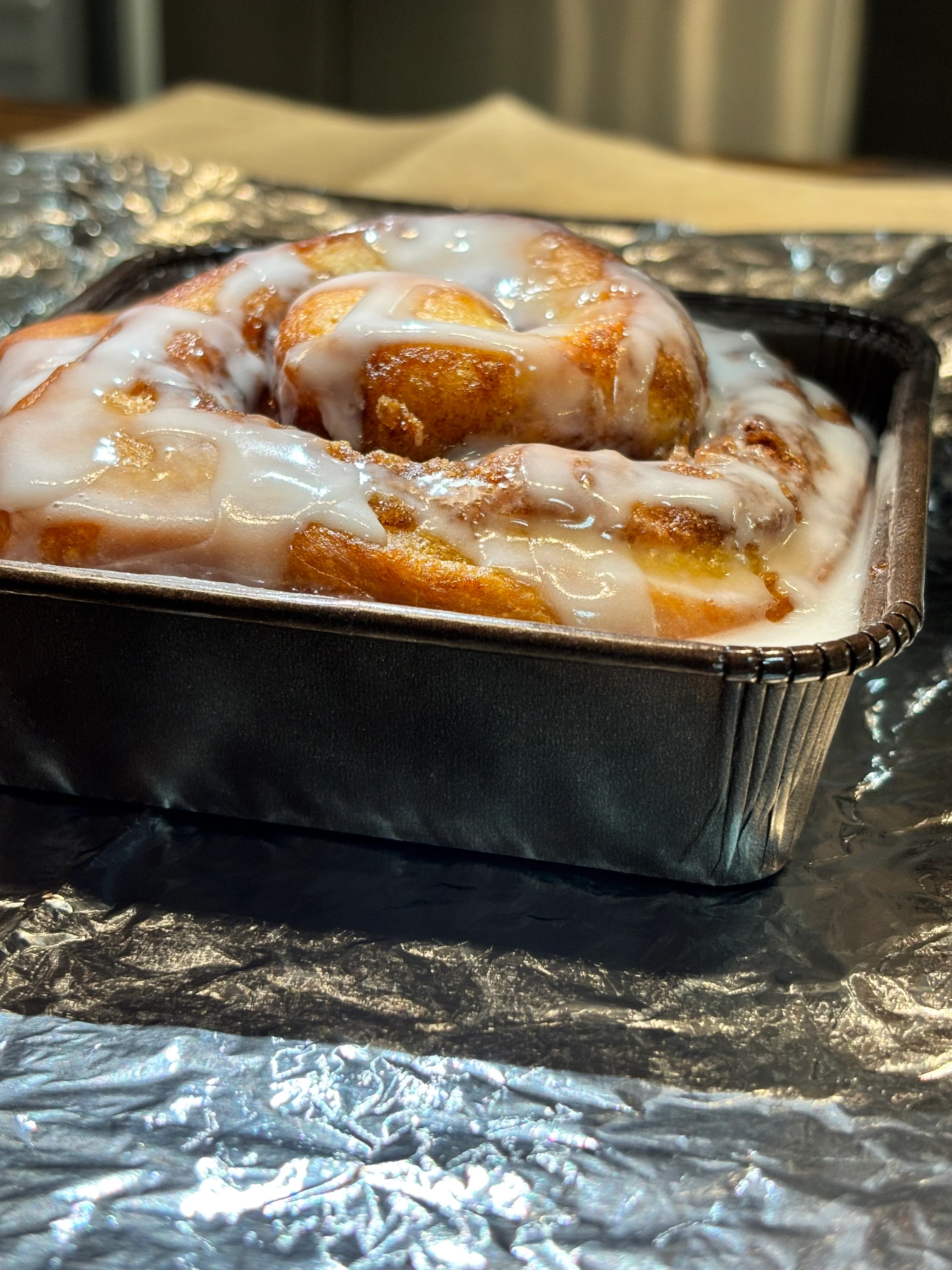 Freshly baked cinnamon roll with icing