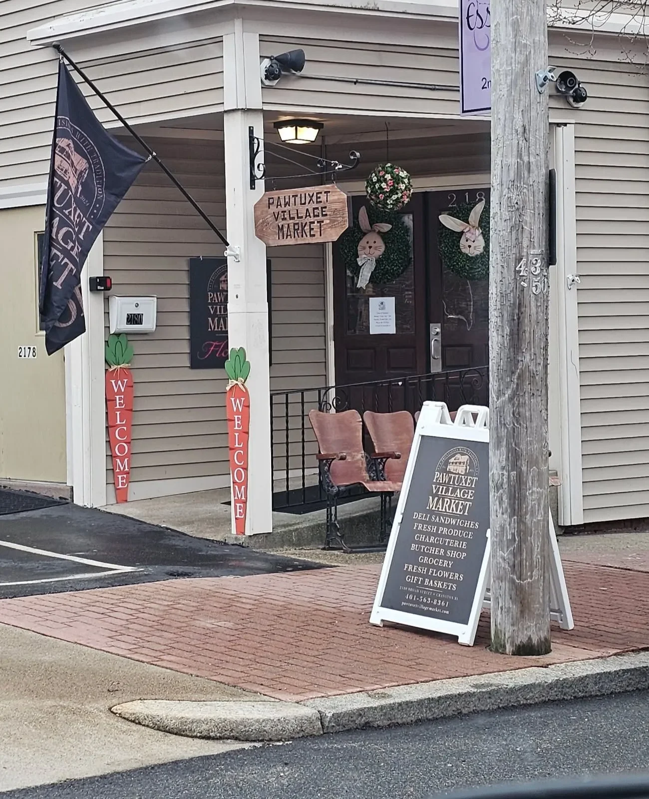 Charming market entrance with seasonal decor and welcoming signs