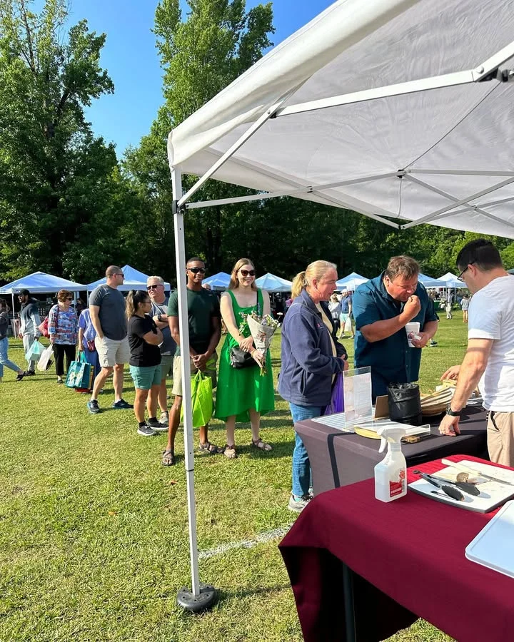 Crowd at a food festival with vendors and tents