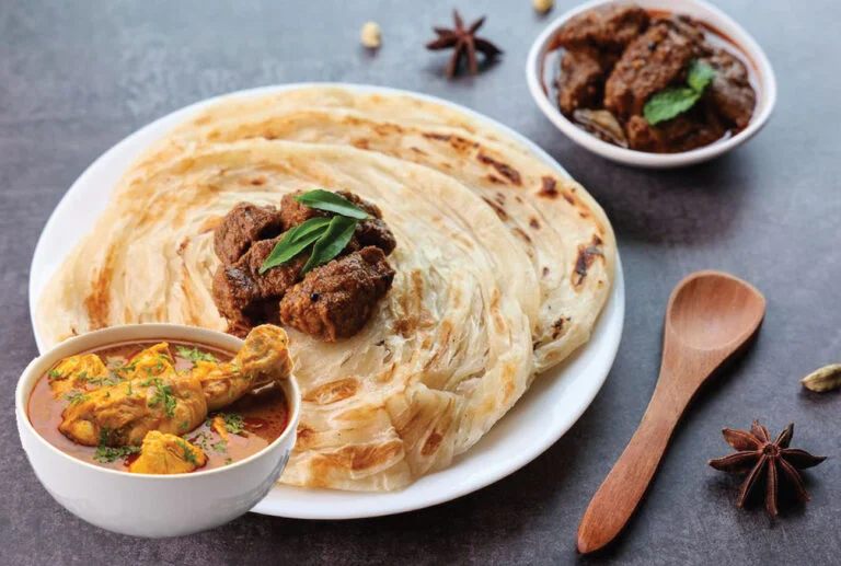 Malaysian roti canai with chicken curry and beef rendang