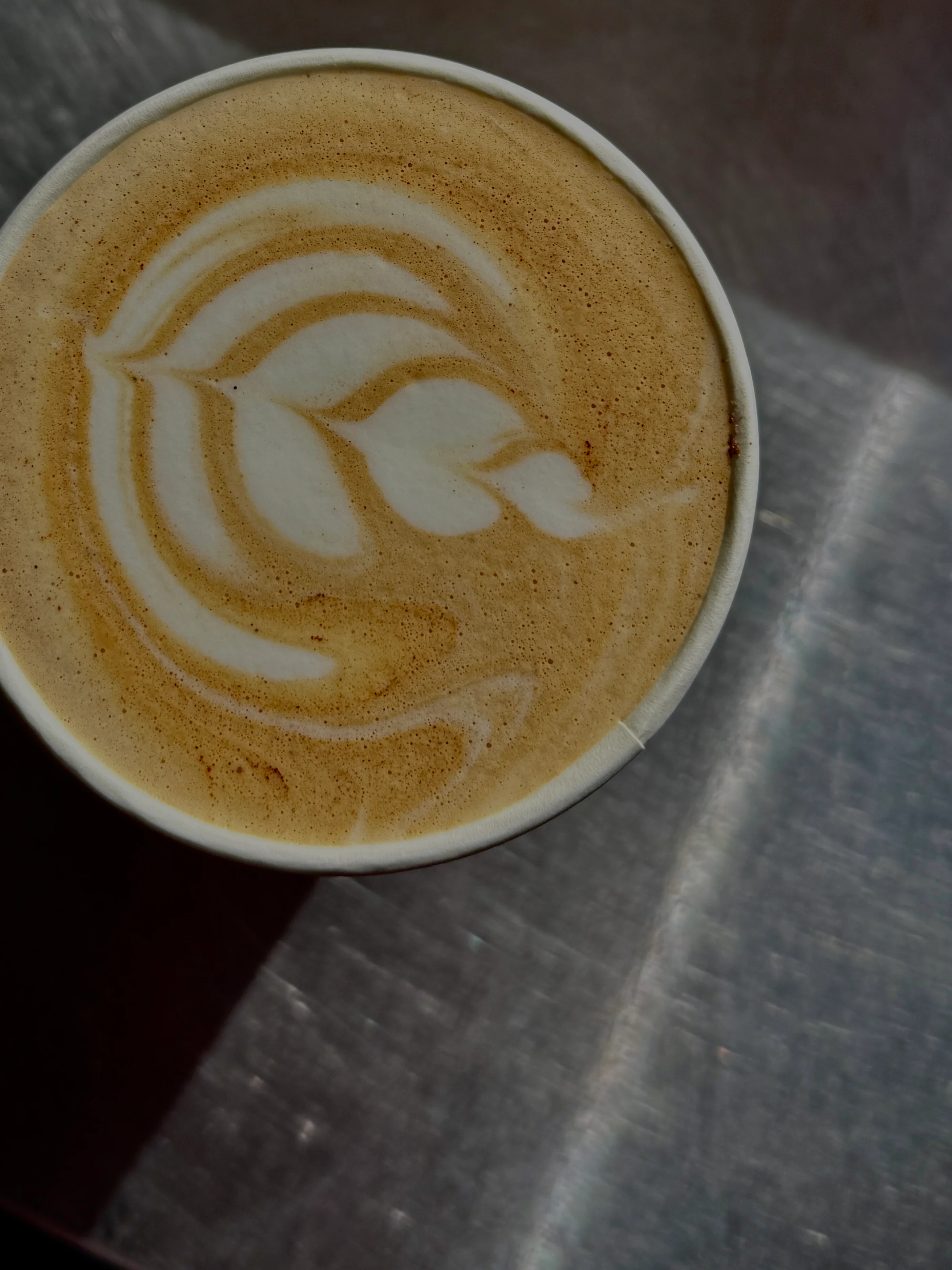 Artisan latte with intricate foam art