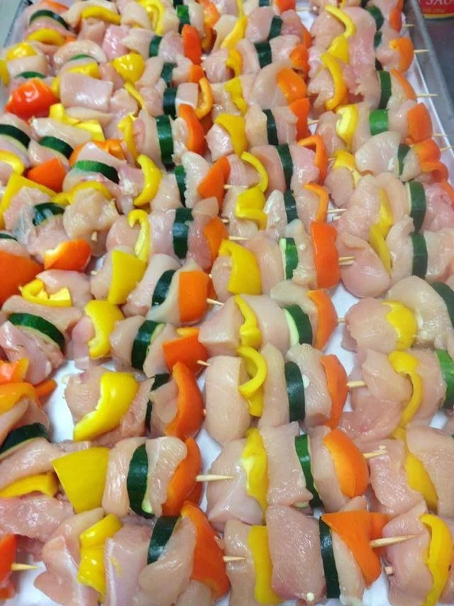 Colorful chicken kebabs ready for grilling