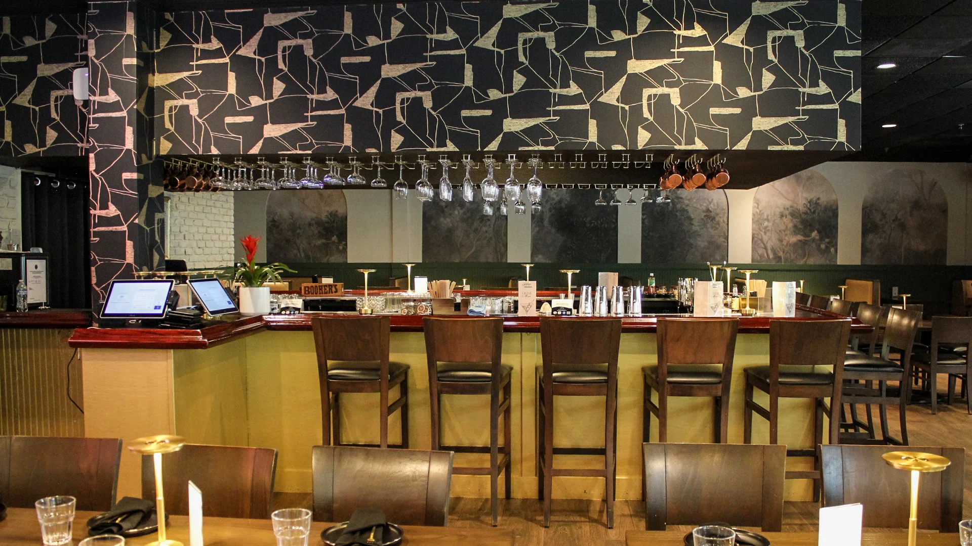 Modern restaurant interior with bar seating and stylish decor