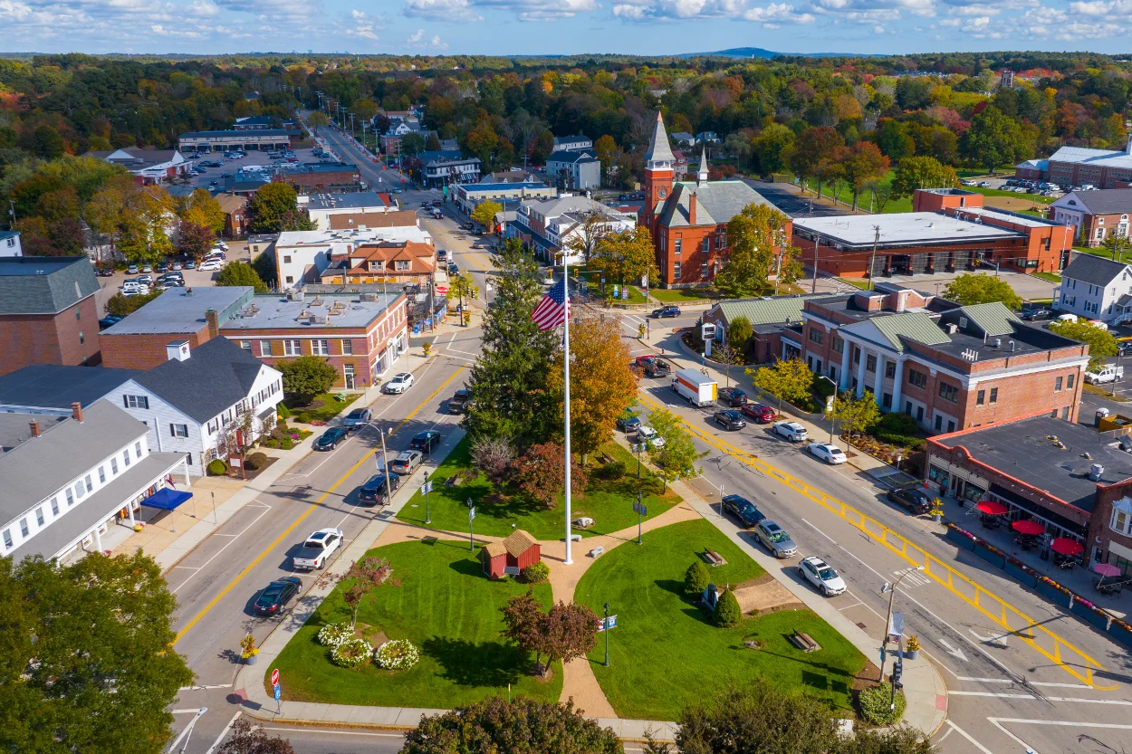 Aerial view of a charming small town with colorful autumn foliage