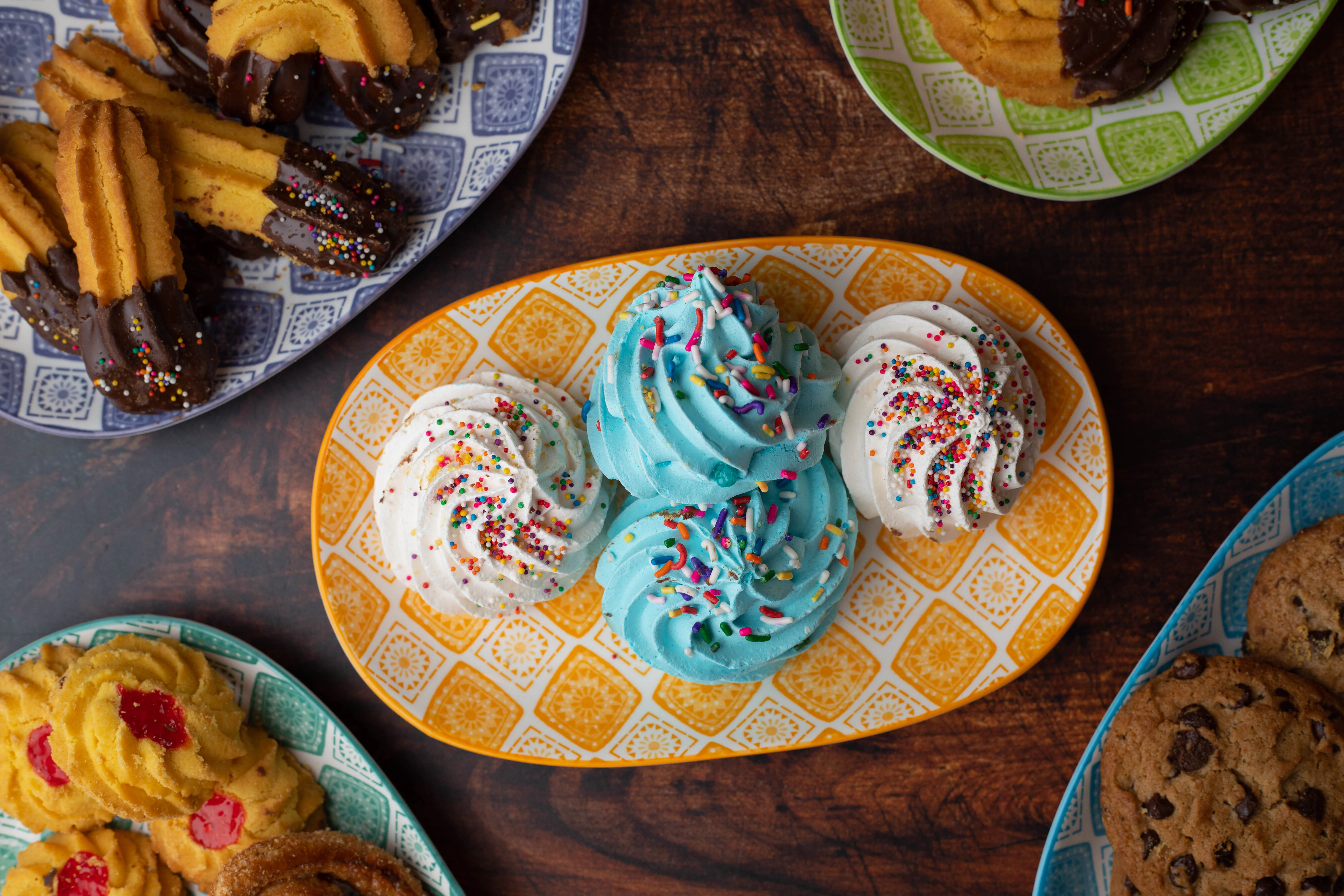 Colorful cupcakes with sprinkles on a decorative platter