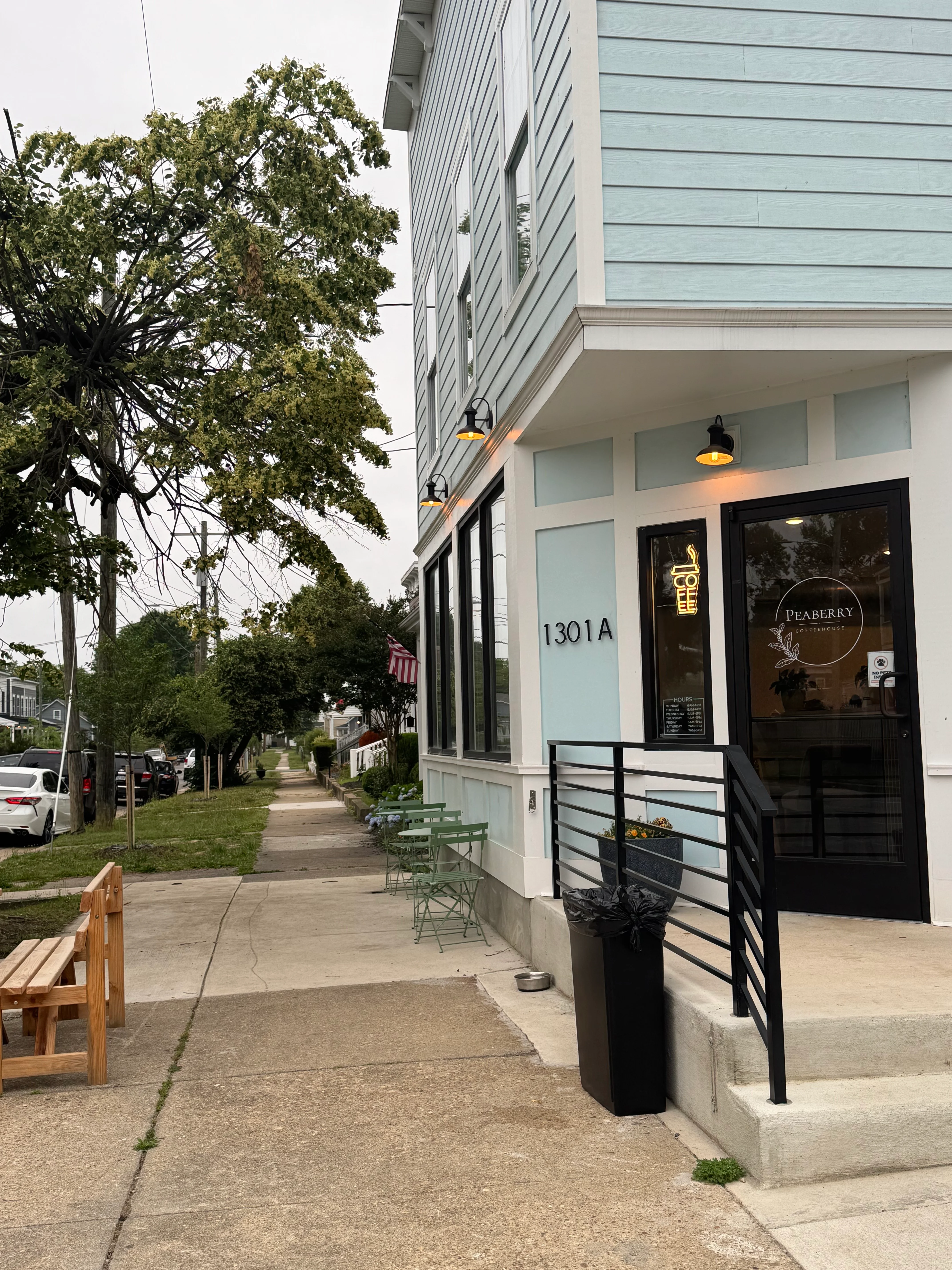 Charming café exterior with outdoor seating and modern design