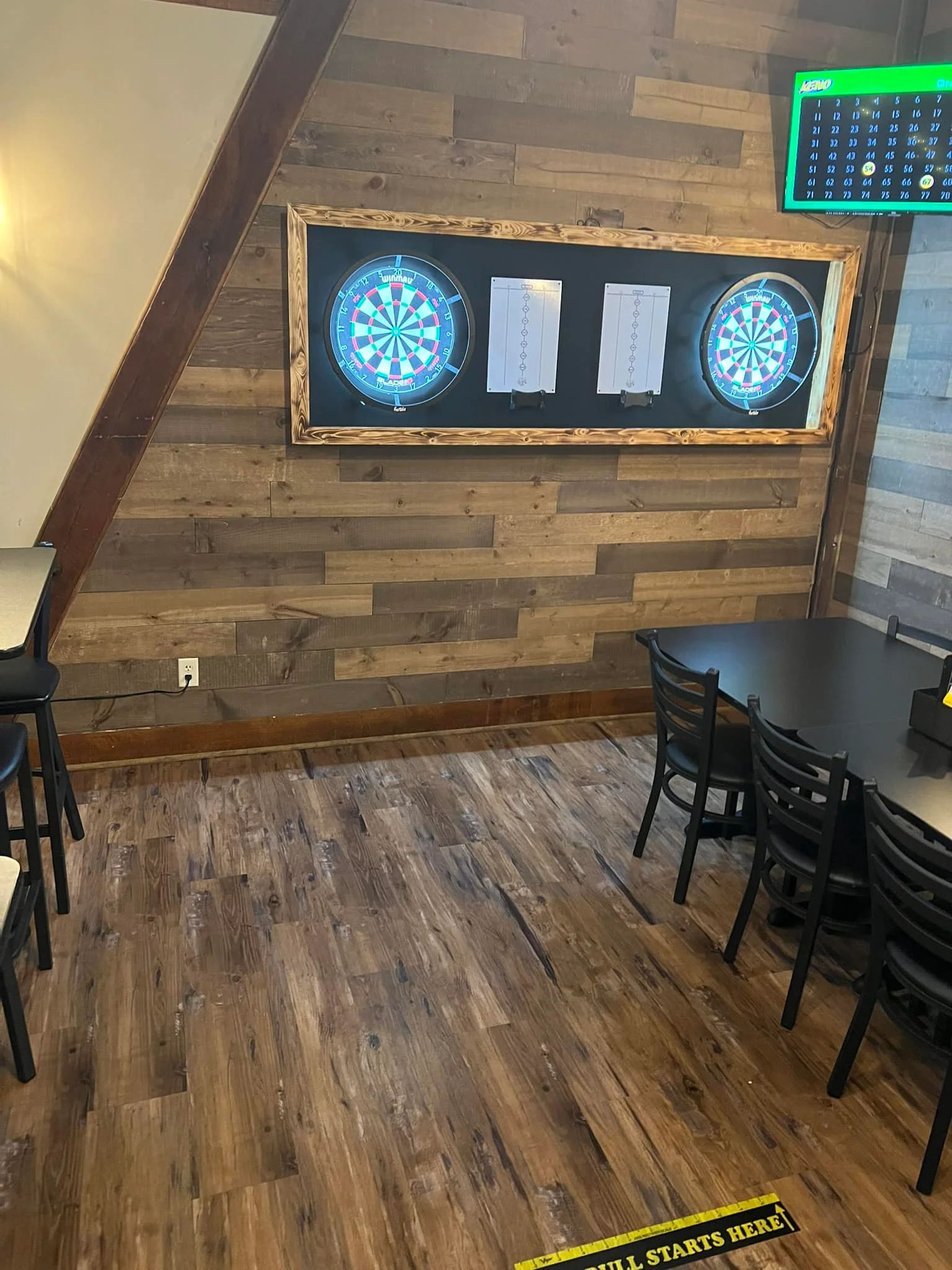 Cozy restaurant interior with dartboards and wooden accents