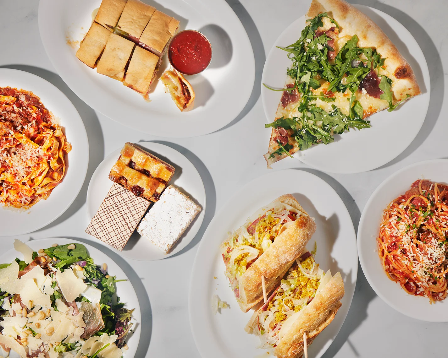 Italian pasta dishes and pizza with fresh toppings