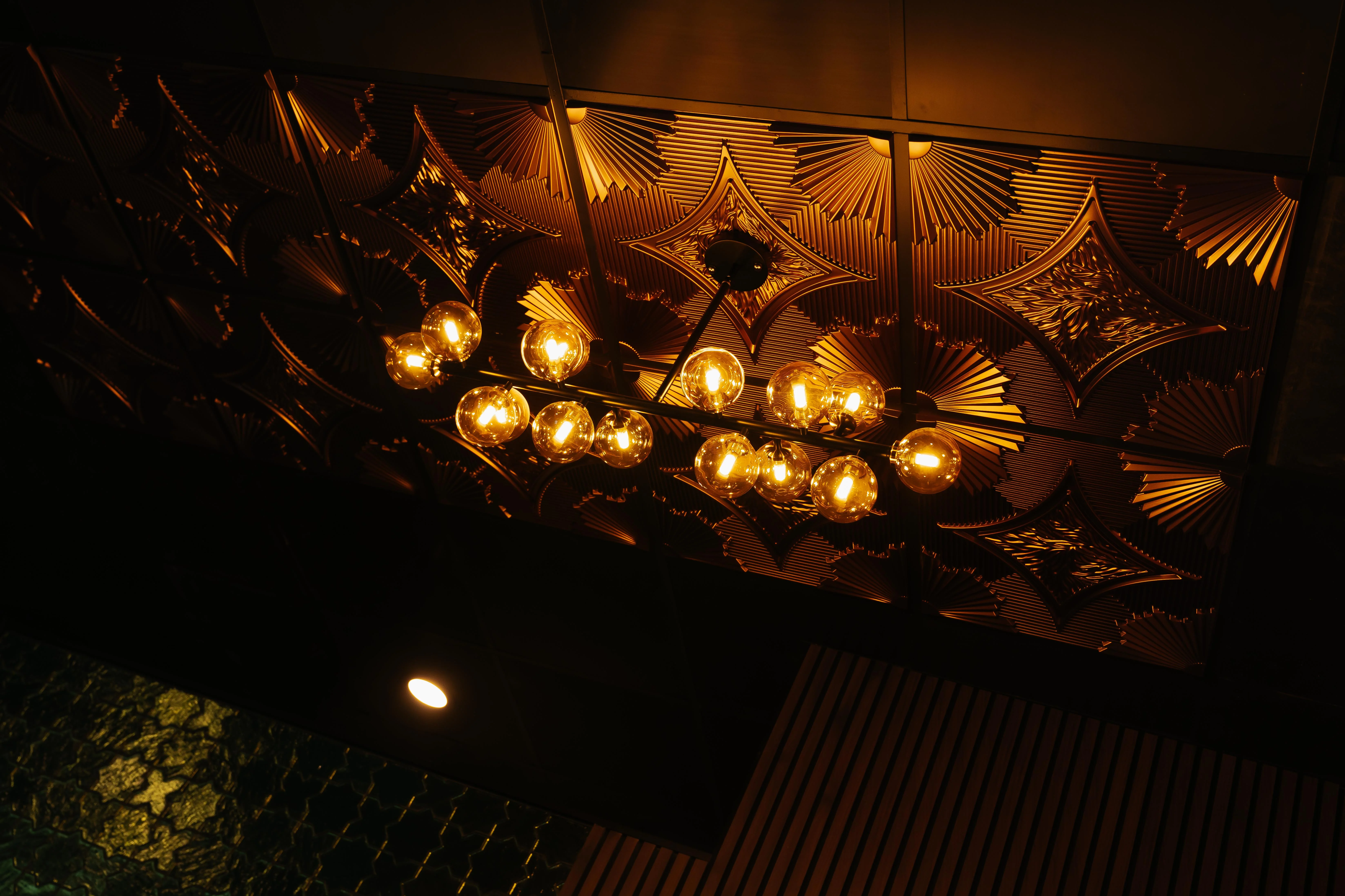 Elegant restaurant ceiling with decorative lighting