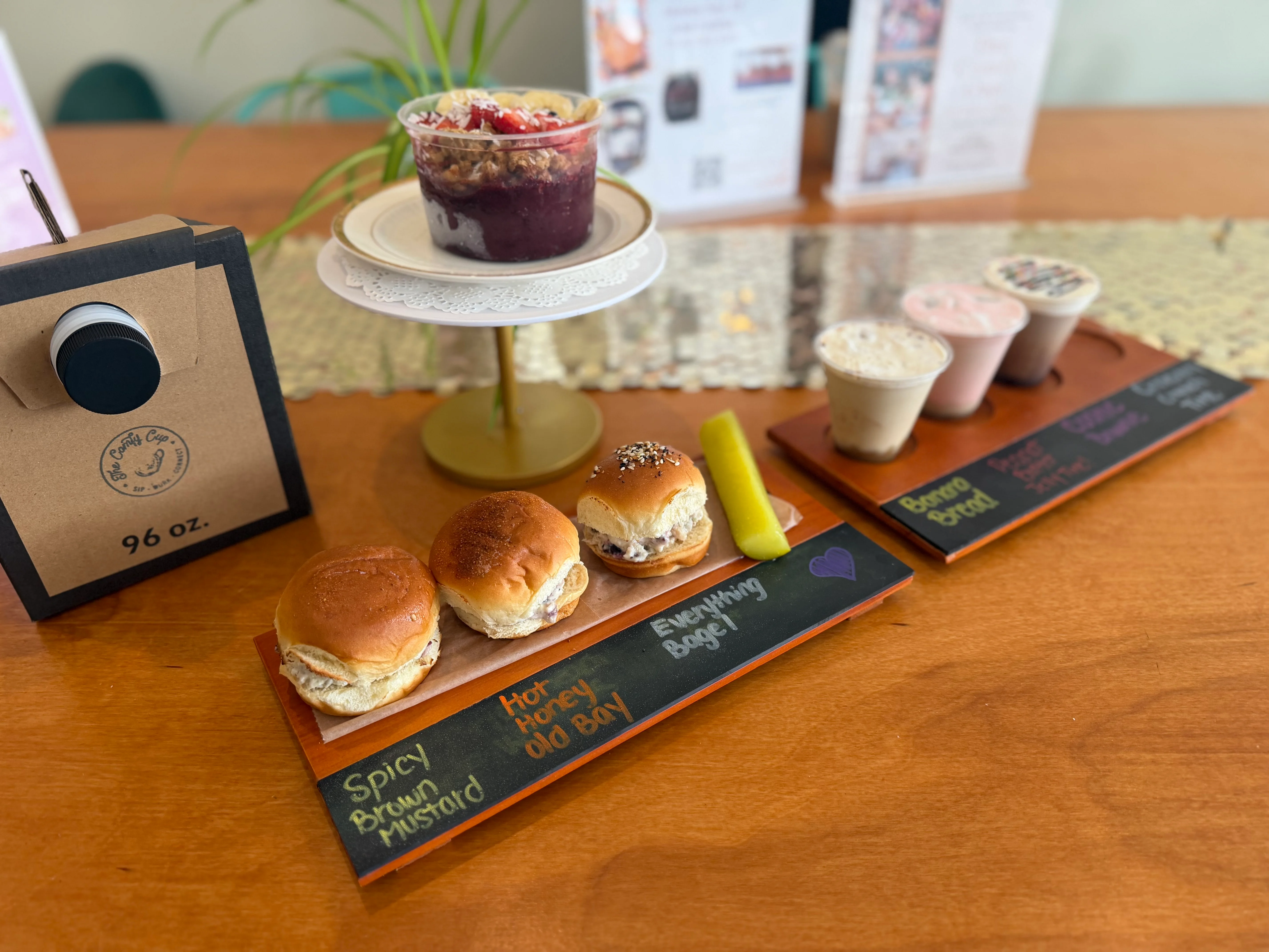 Artisan sliders with unique toppings on a wooden platter