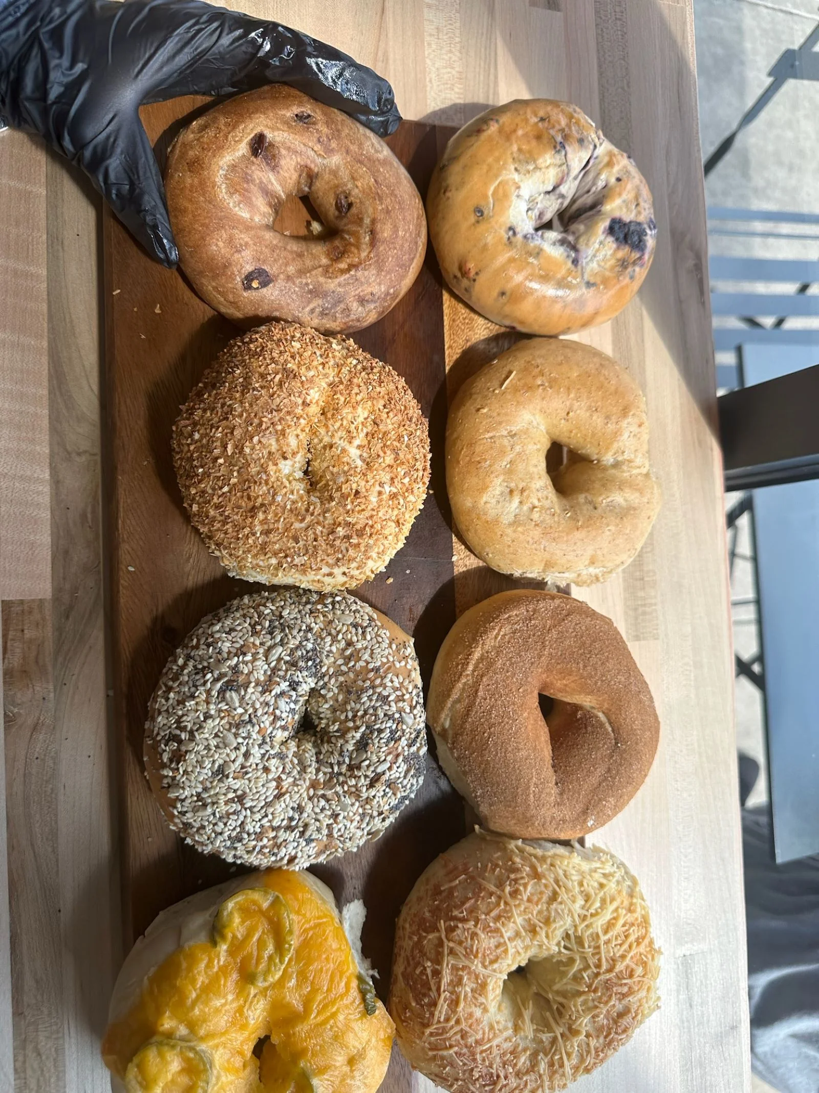 Assorted bagels on a wooden board