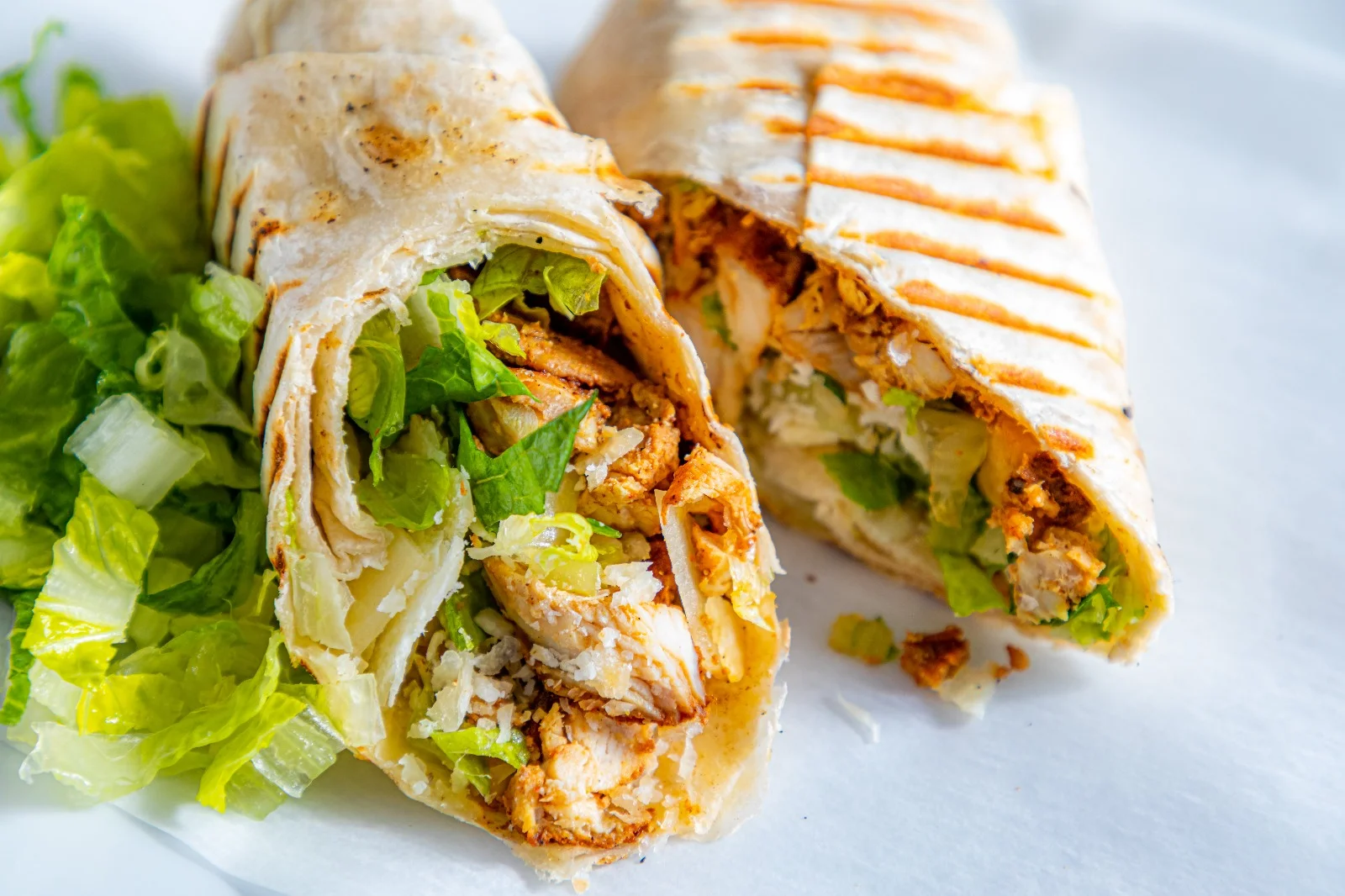 Grilled chicken wrap with lettuce in a tortilla