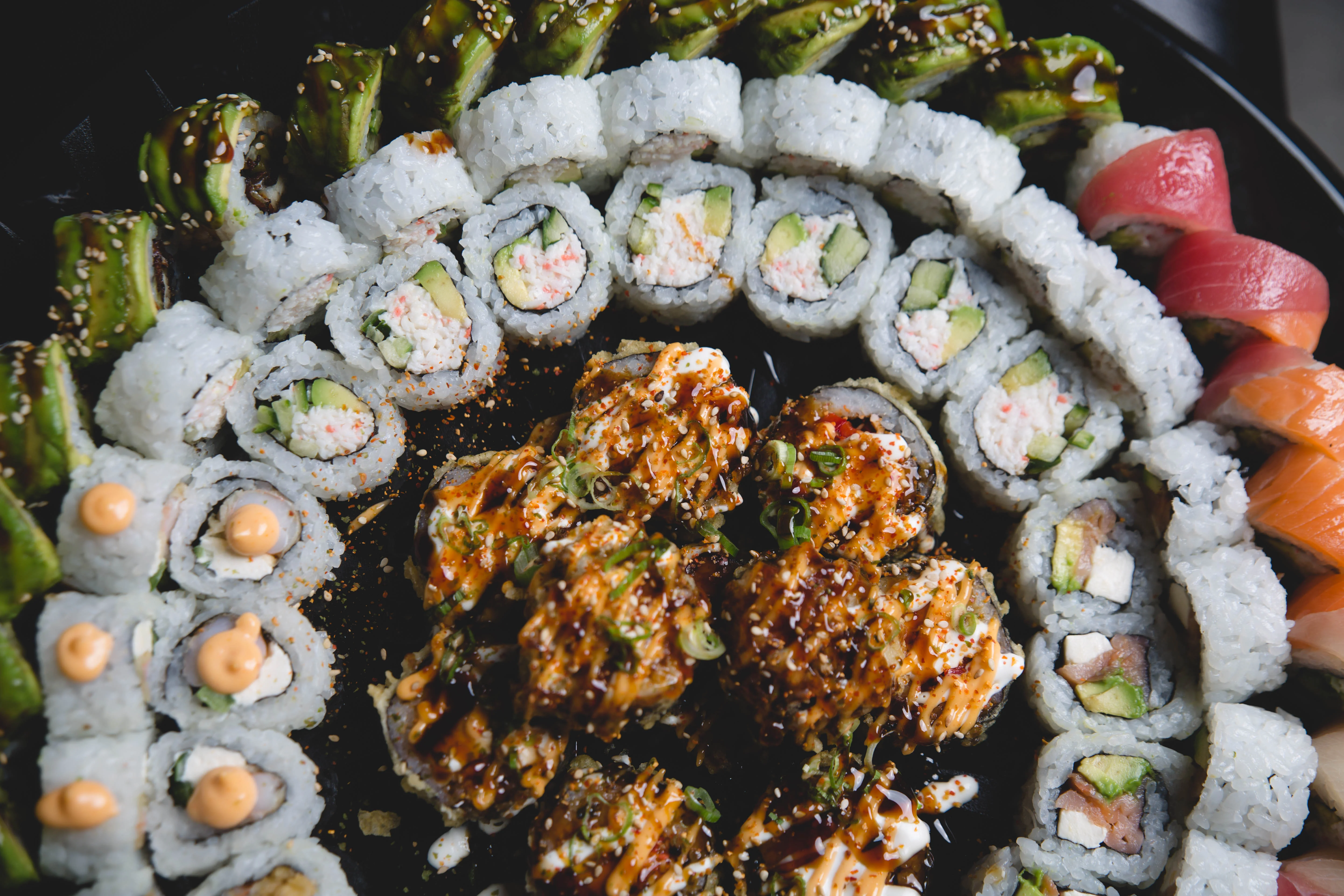 Assorted sushi platter featuring rolls and sashimi