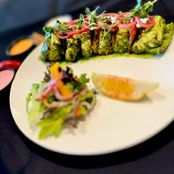 Grilled Indian tandoori chicken with mint chutney and salad