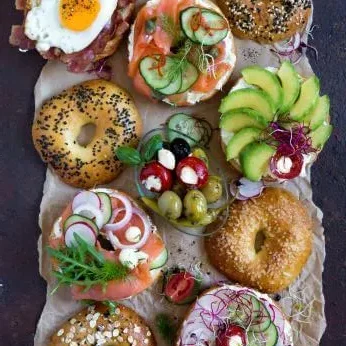 Assorted bagels with toppings in a vibrant display