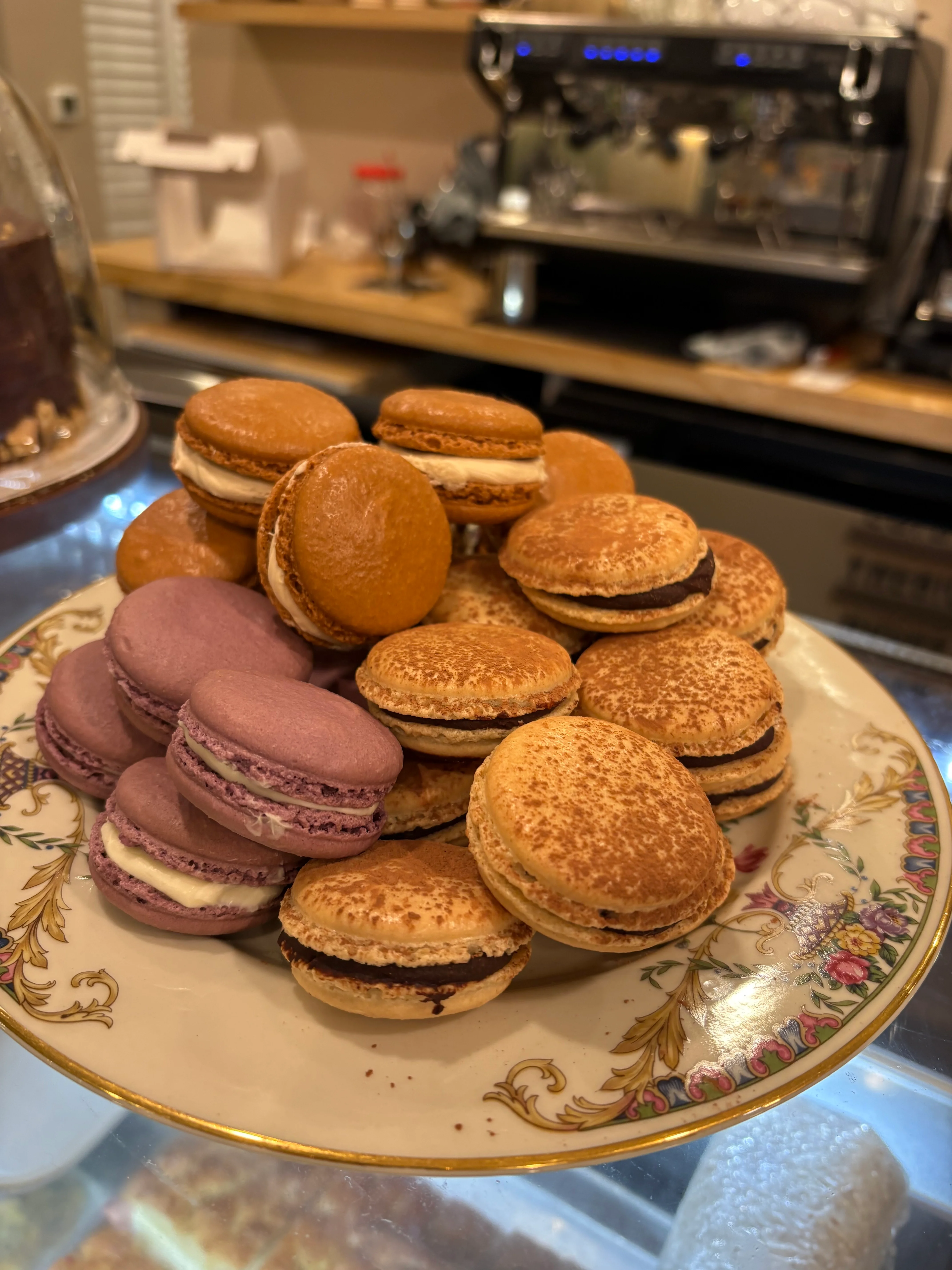 Assorted French macarons on a decorative plate