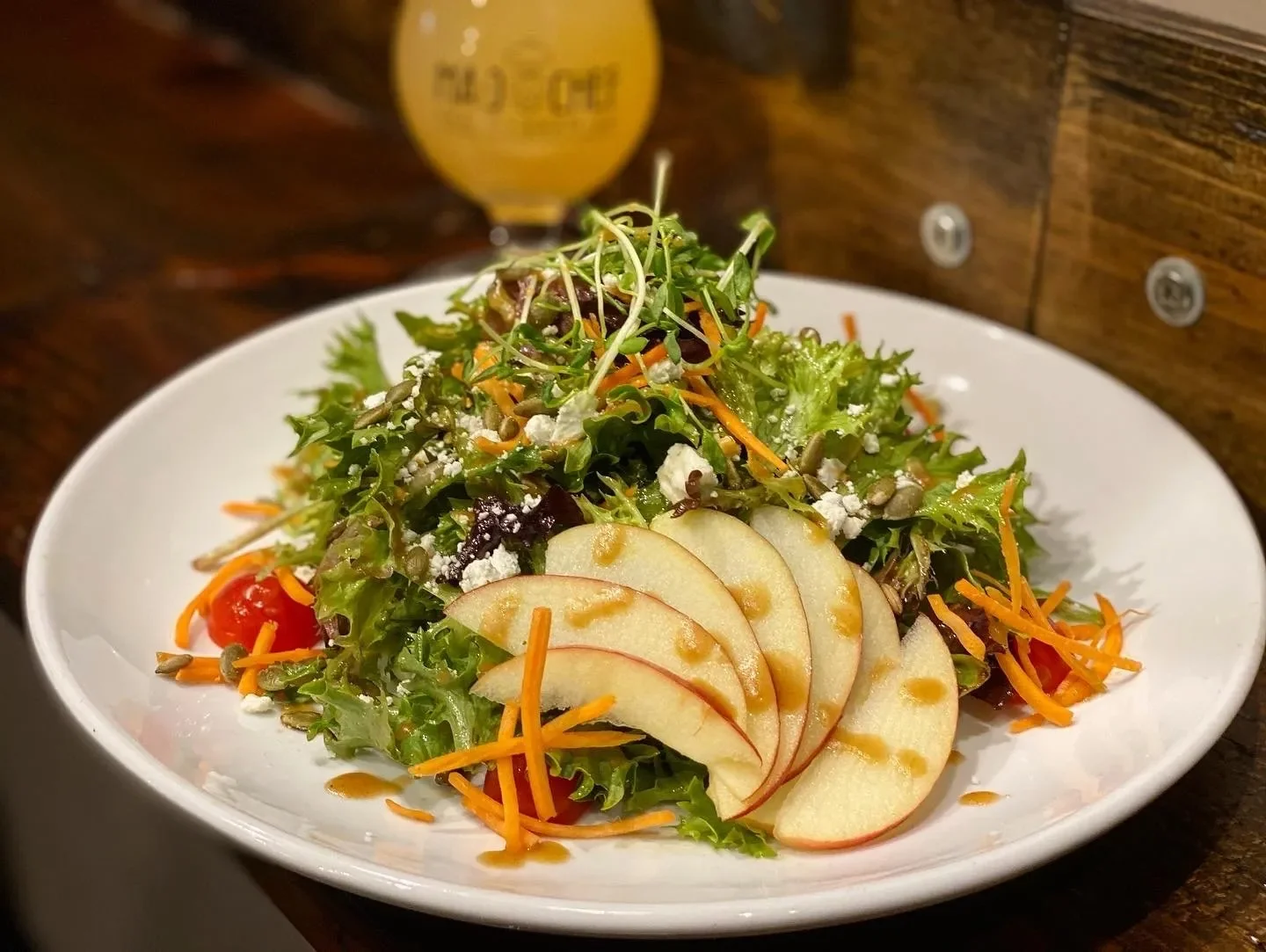 Fresh garden salad with apple slices and mixed greens