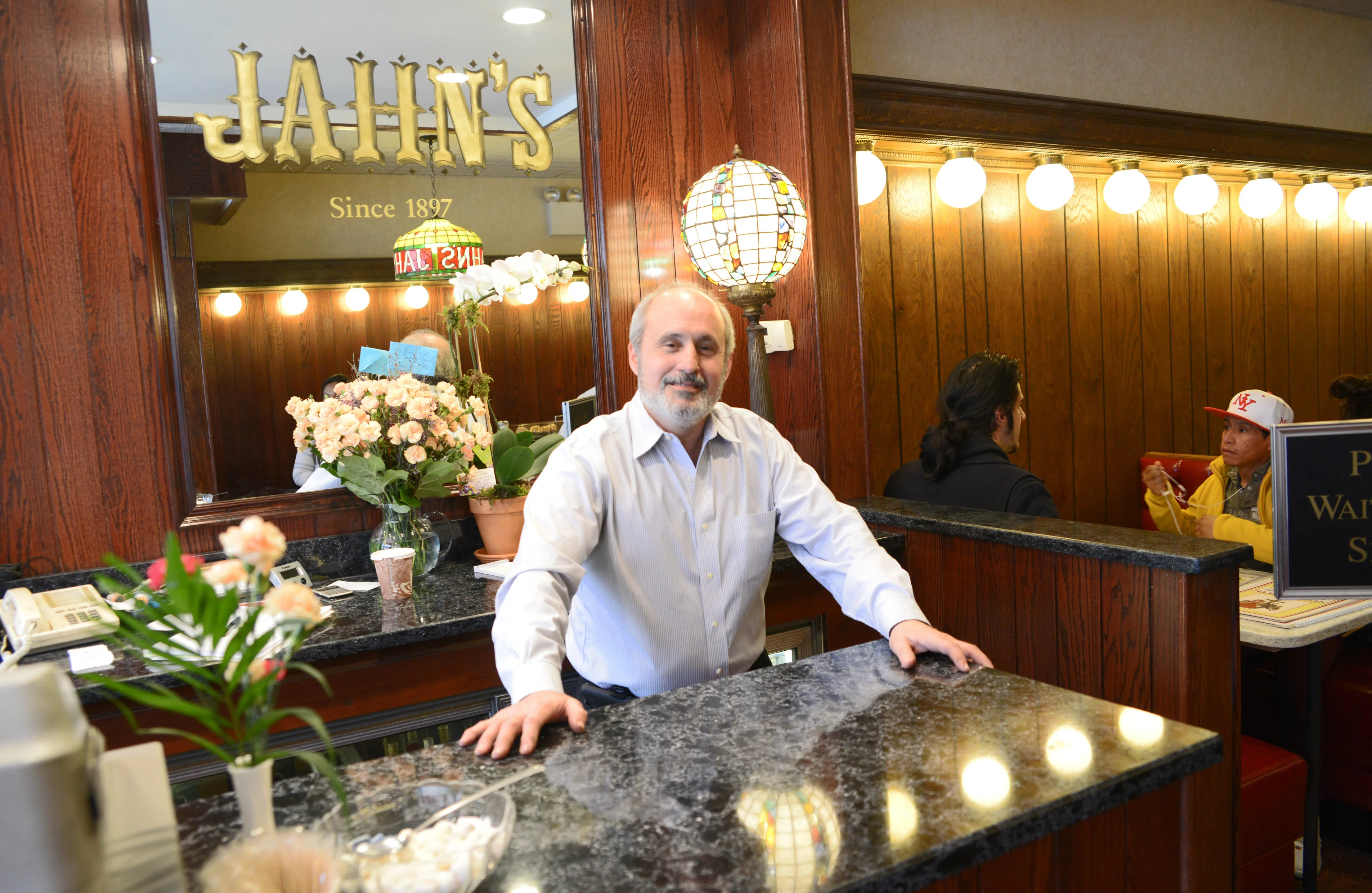 Welcoming restaurant reception area with floral decor