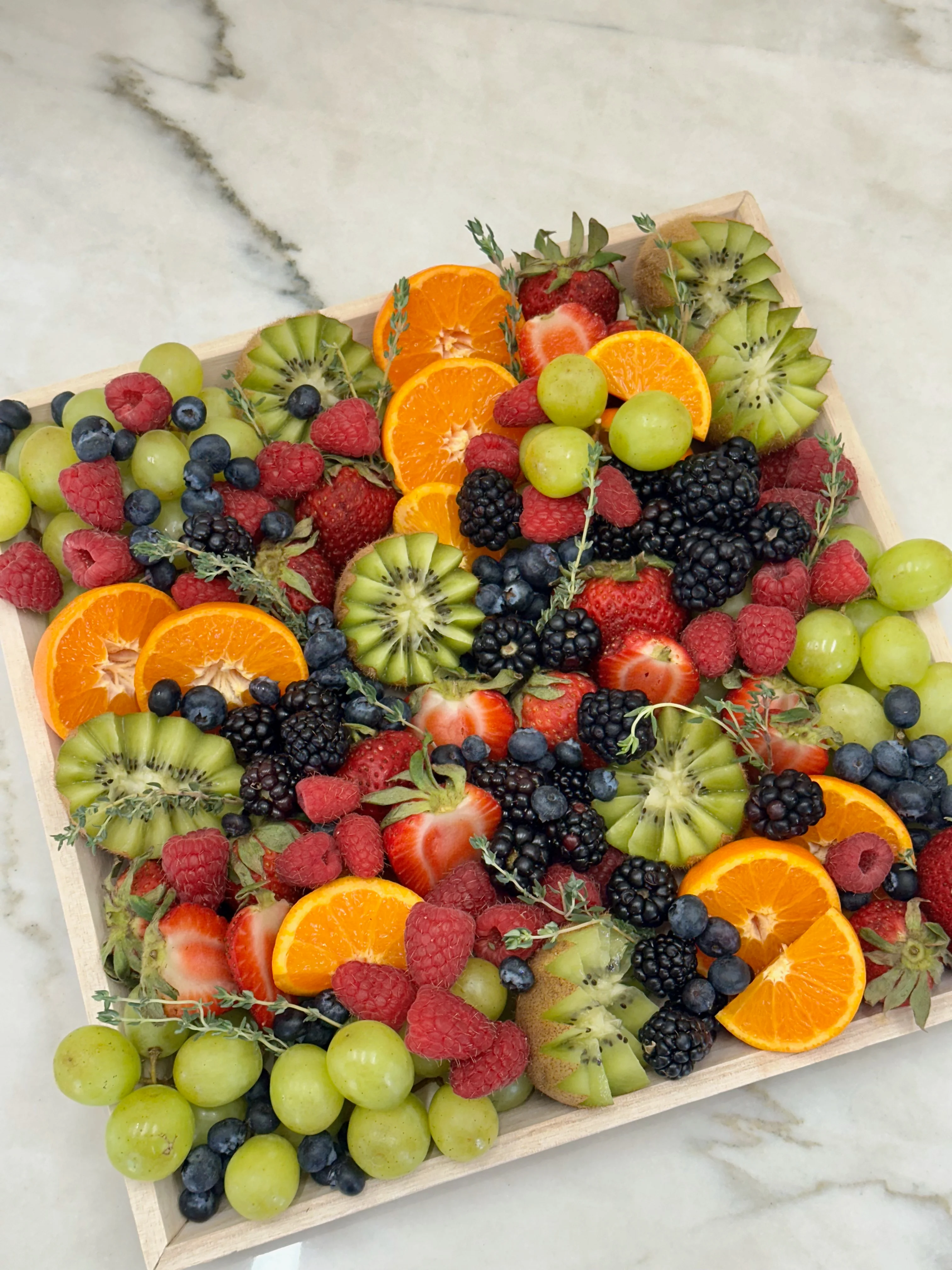 Artisan charcuterie and pastry box with fresh fruits
