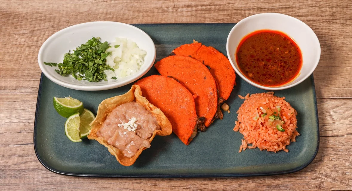 Colorful Mexican tacos with rice and beans