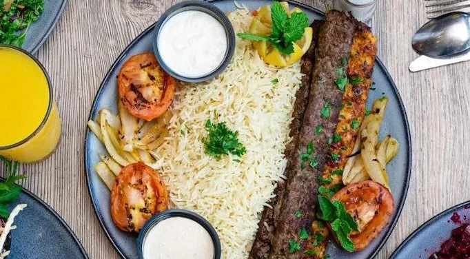 Middle Eastern food spread with group dining promotion