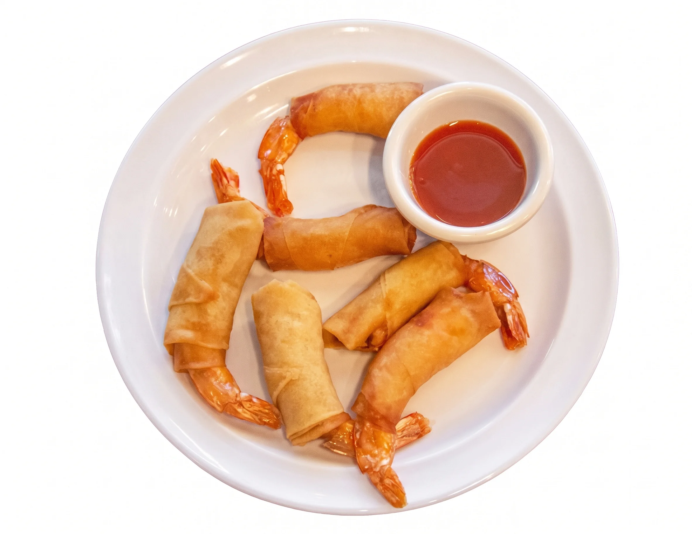 Plate of shrimp spring rolls with dipping sauce