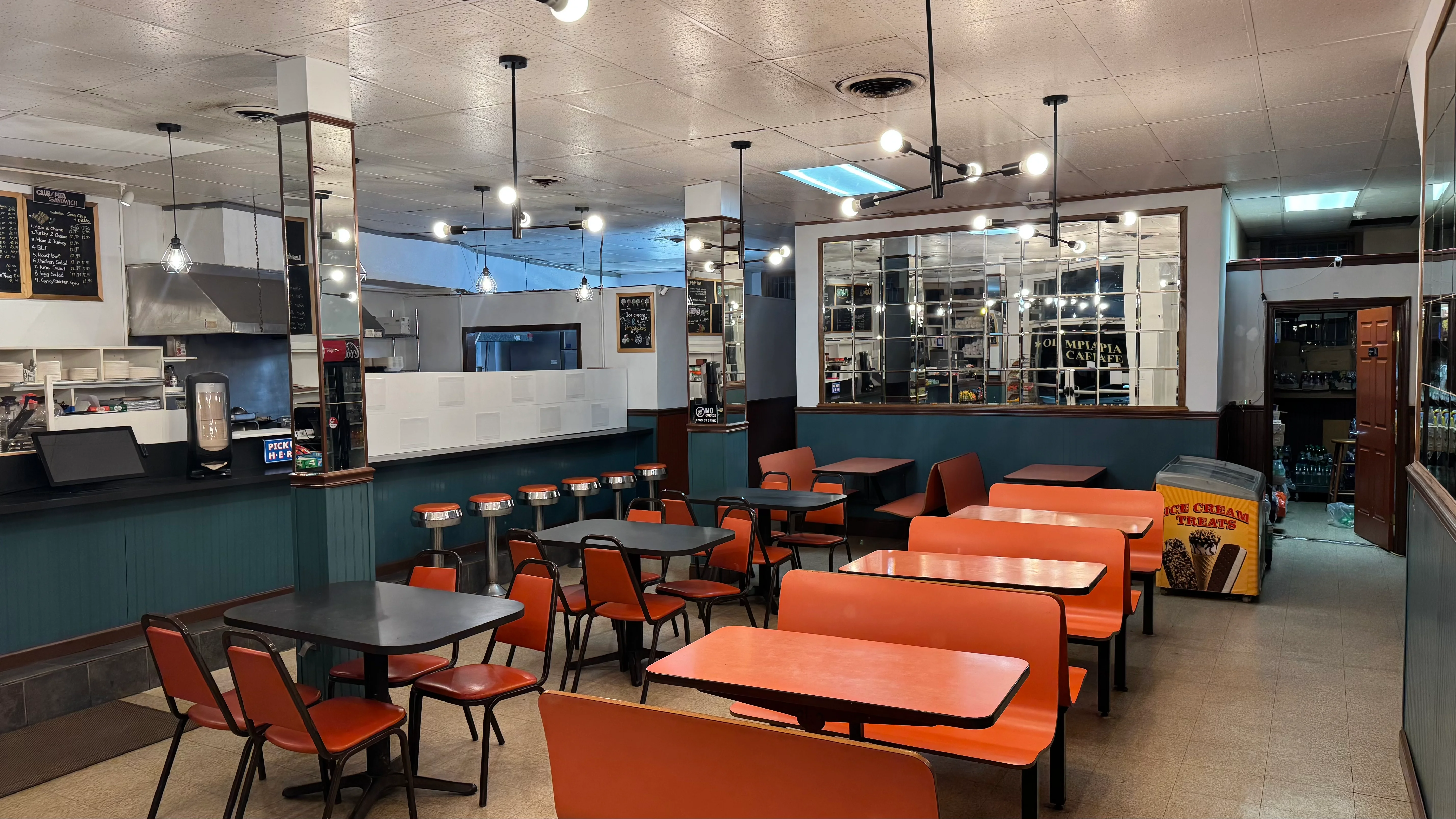 Cozy restaurant interior with colorful seating and modern lighting