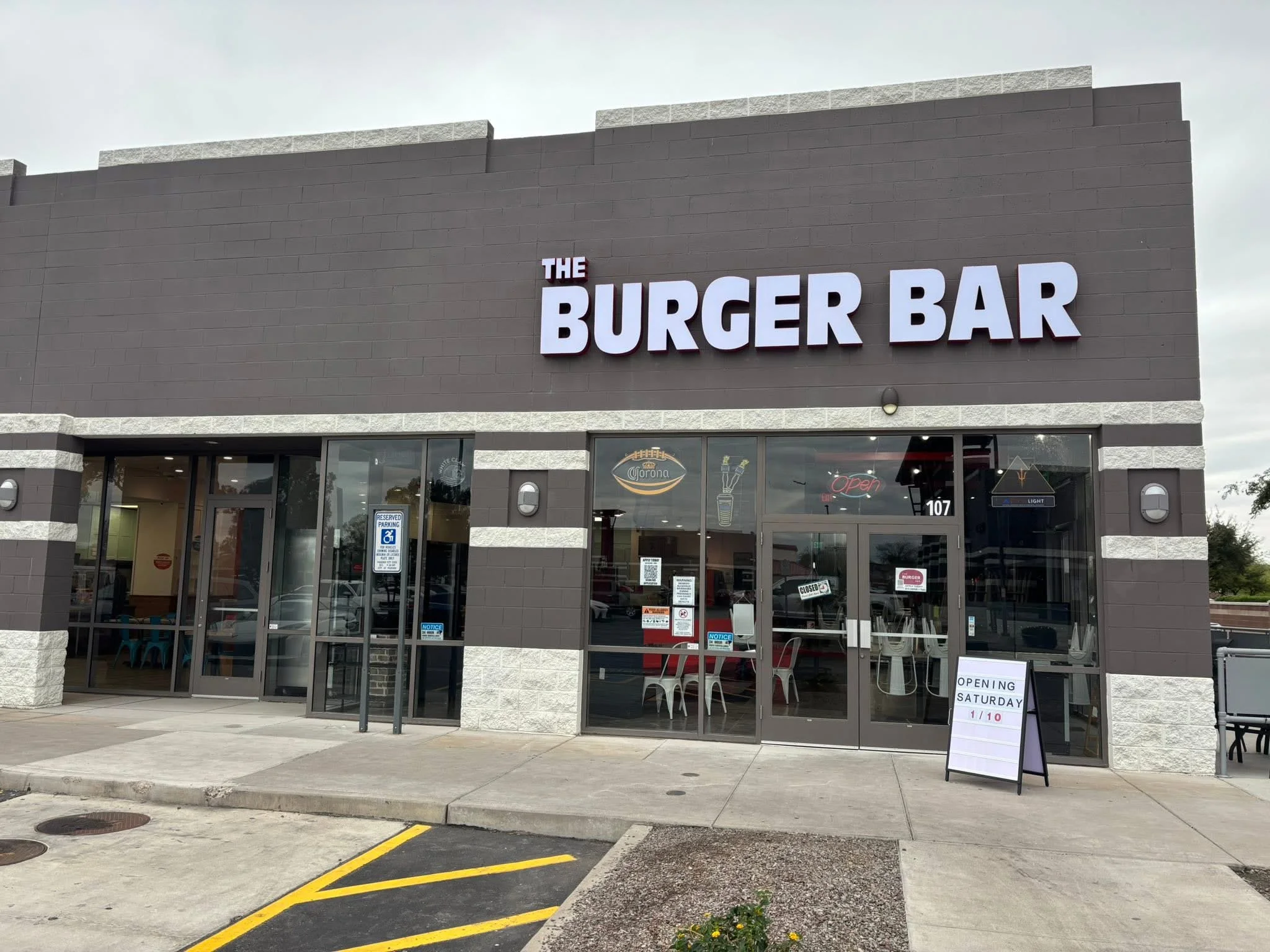 Exterior view of The Burger Bar restaurant with signage
