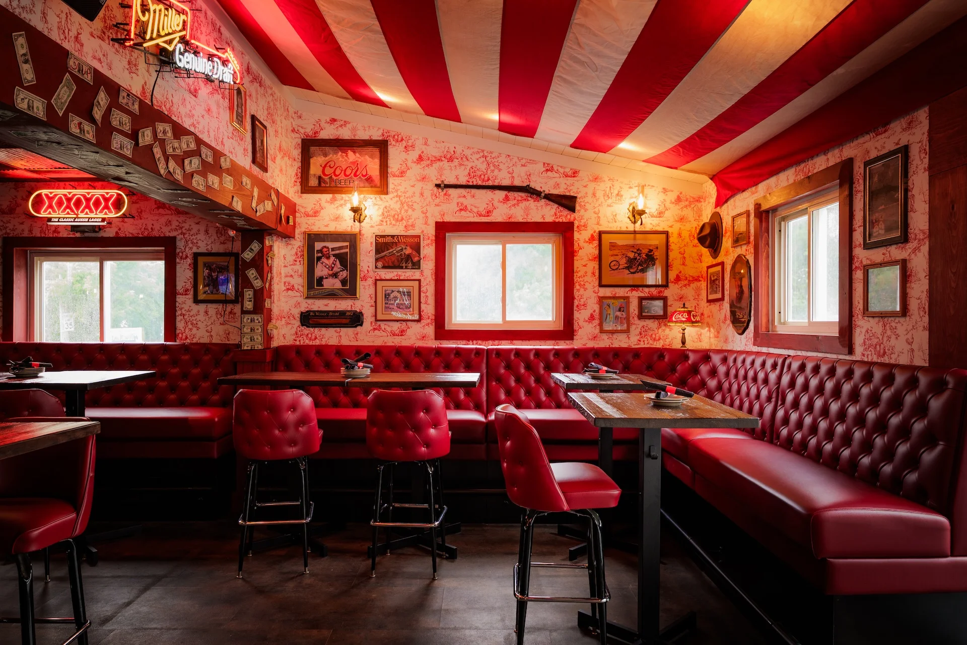Cozy restaurant interior with red striped ceiling and vintage decor