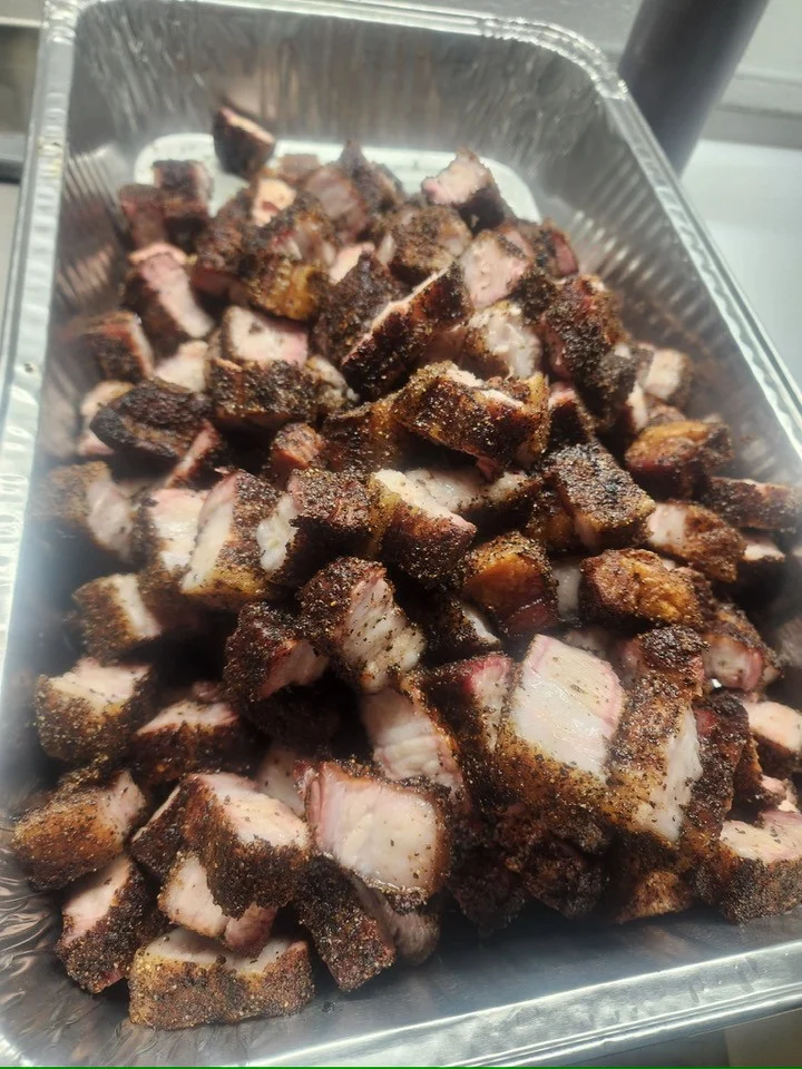 Smoked brisket burnt ends in a catering tray