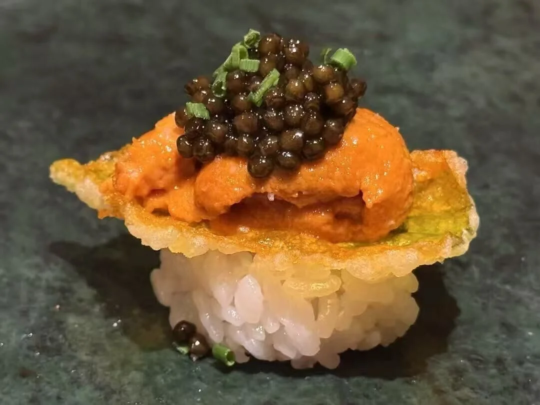 Japanese sushi with sea urchin and caviar on crispy rice