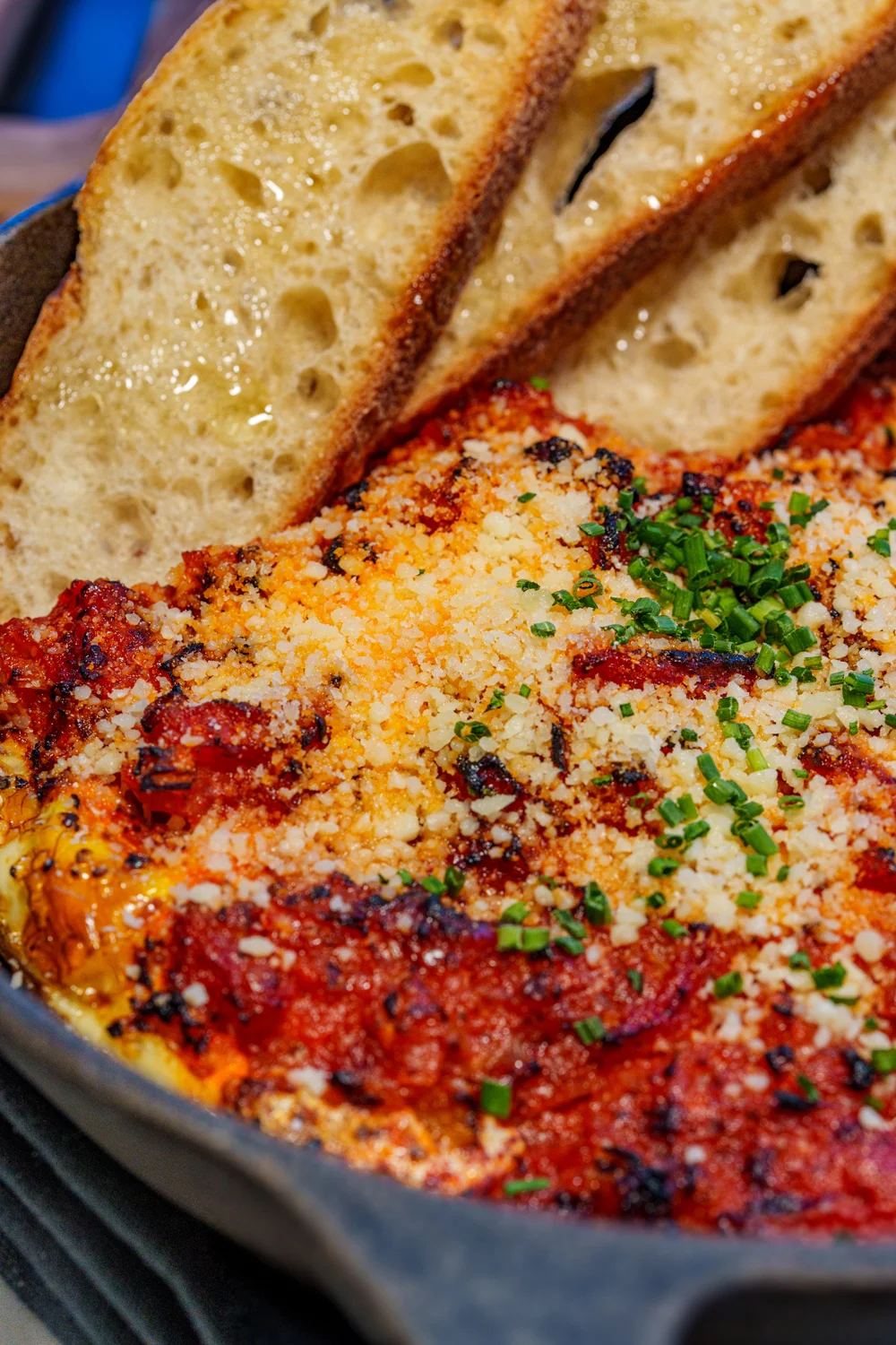 Baked Italian shakshuka with crusty bread