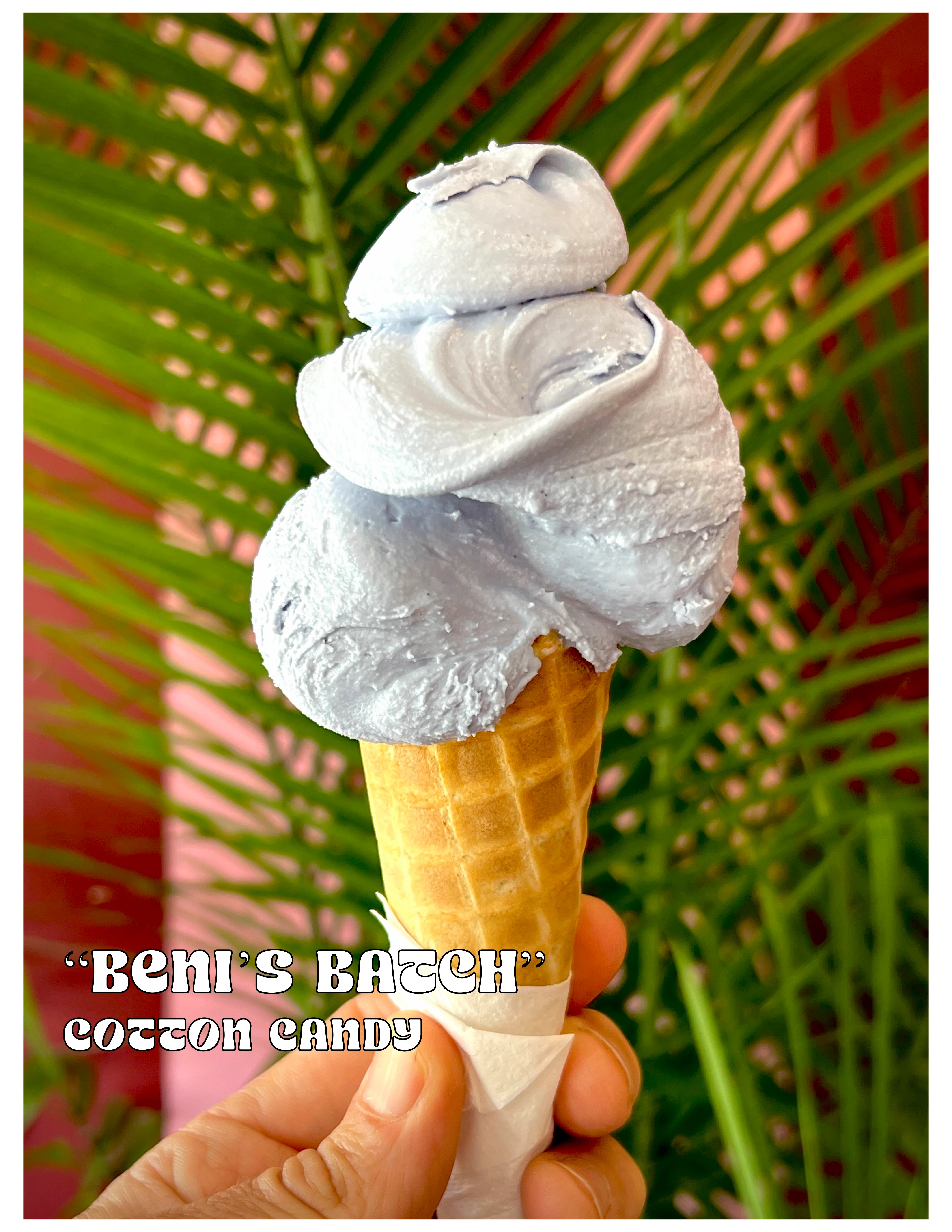 Cotton candy ice cream cone with vibrant blue swirl