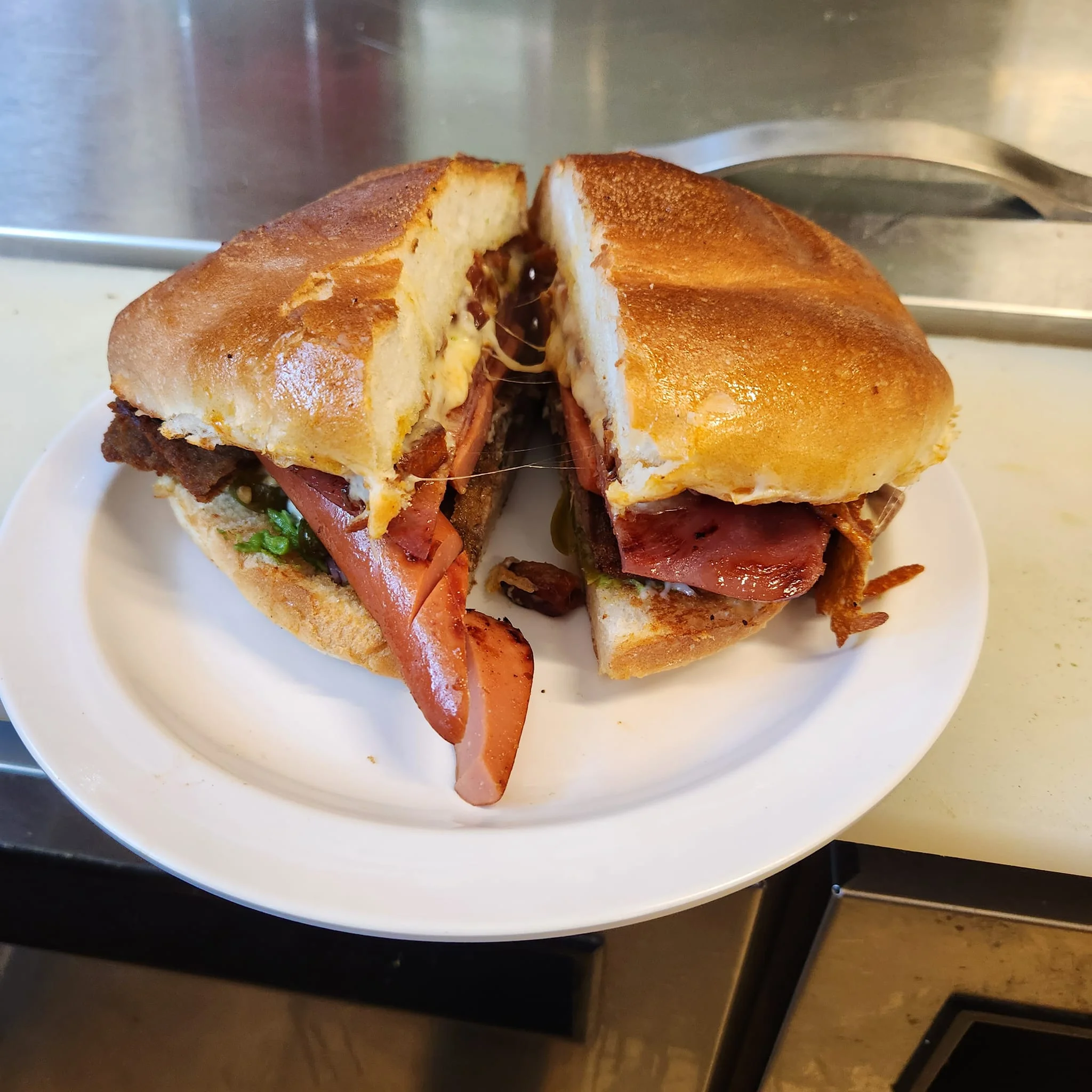 Delicious gourmet burger with fresh toppings on a wooden table