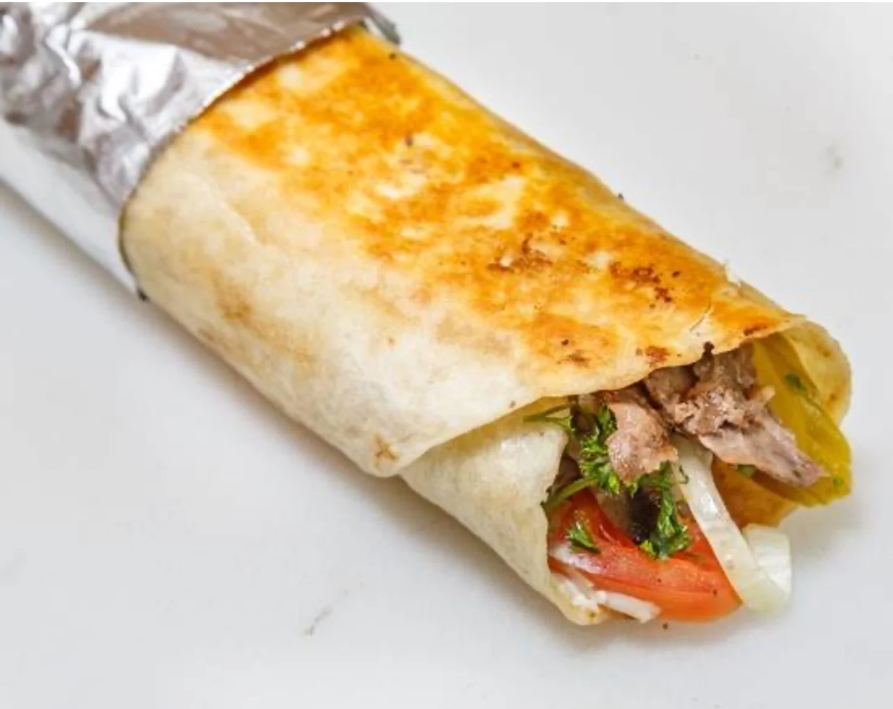 Delicious Mexican burrito wrapped in foil