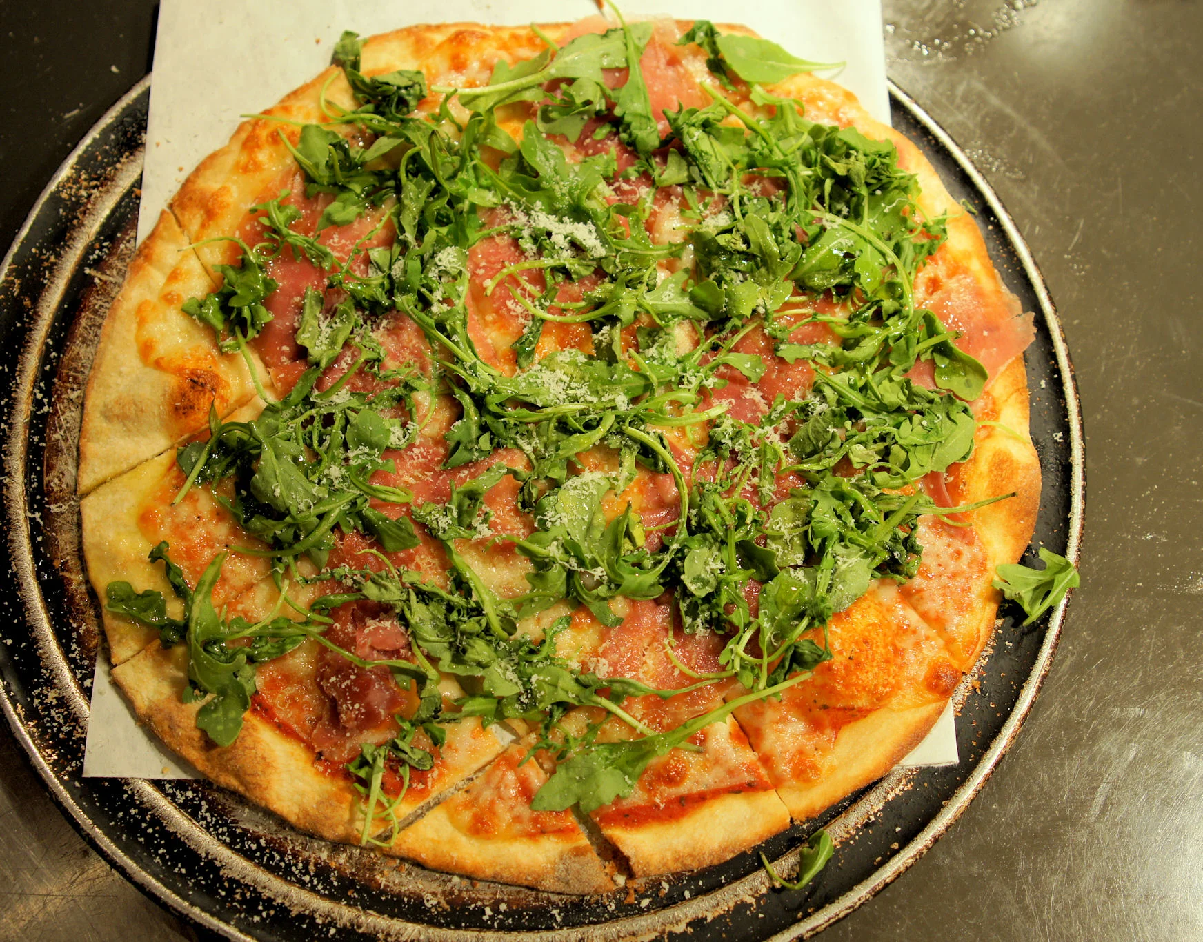 Arugula and prosciutto pizza from Italy