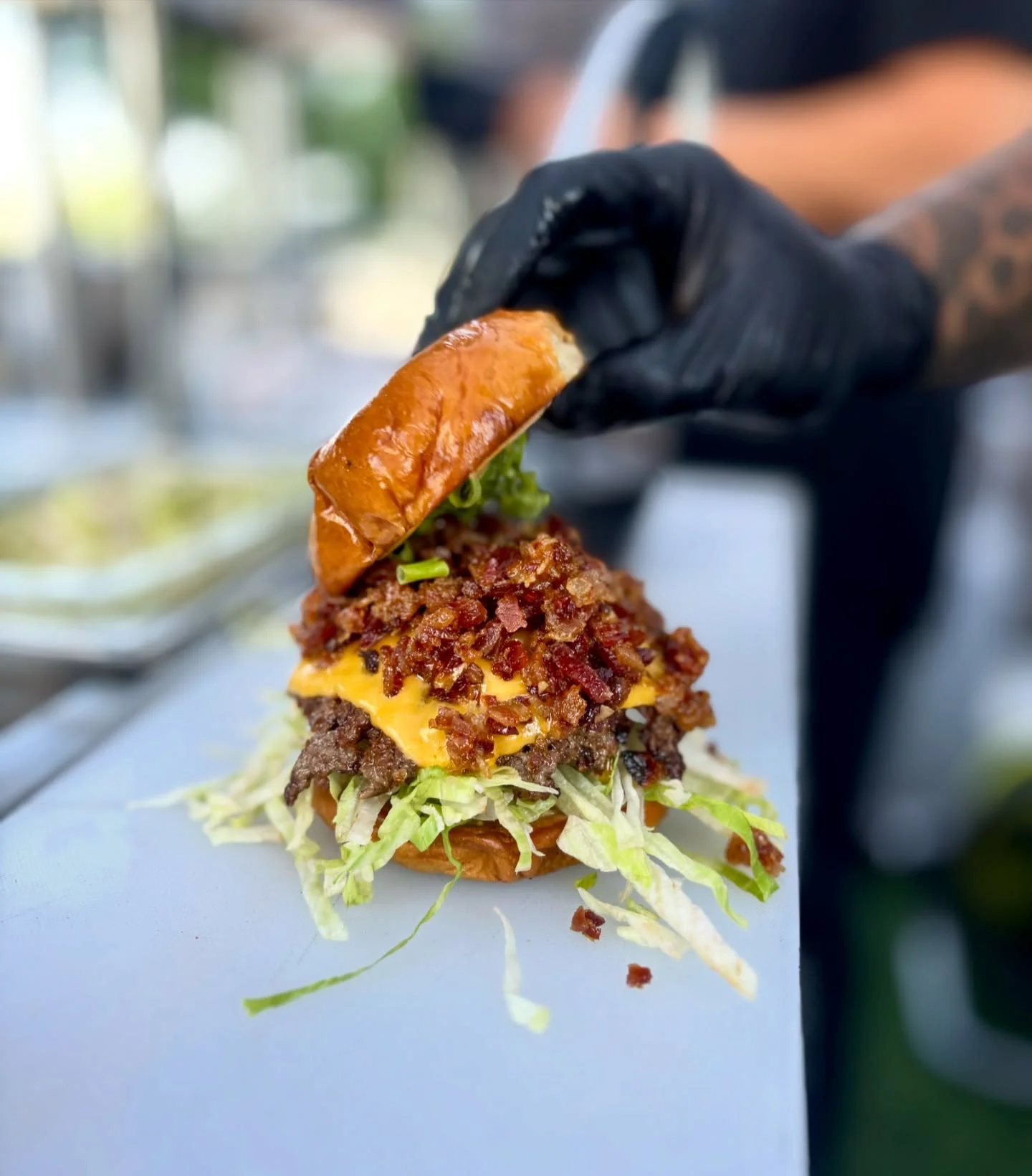 Loaded cheeseburger with bacon and lettuce