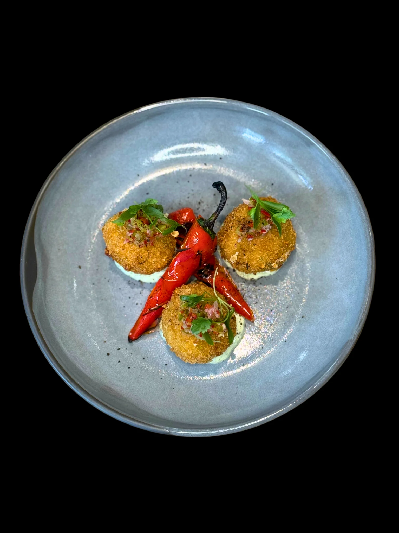 Crispy croquettes with red peppers, a Spanish tapas dish
