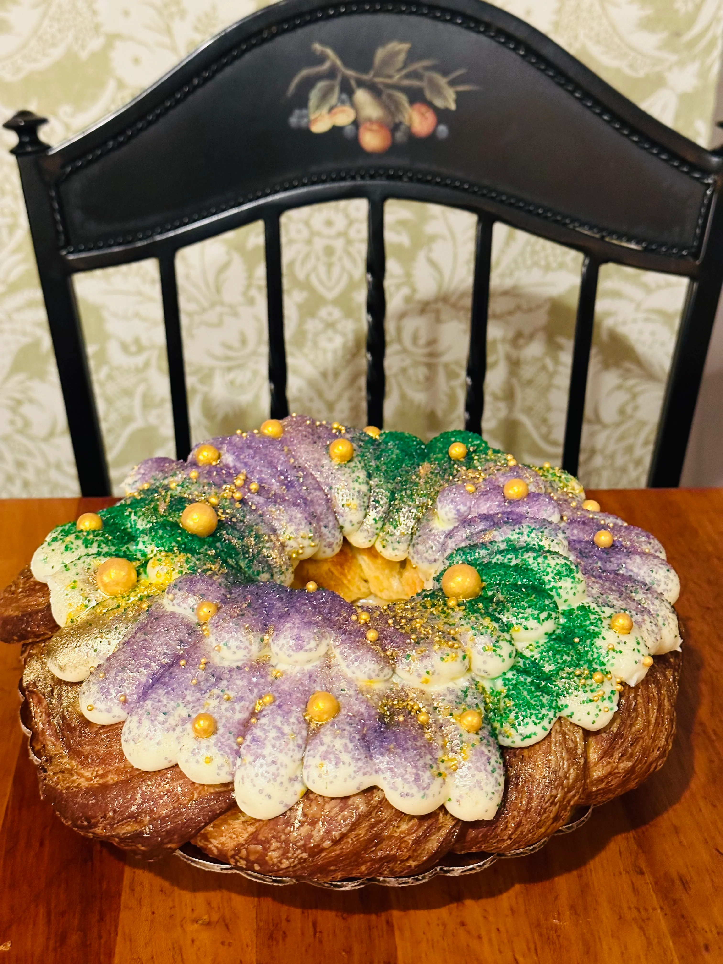 Colorful King Cake decorated for Mardi Gras celebration