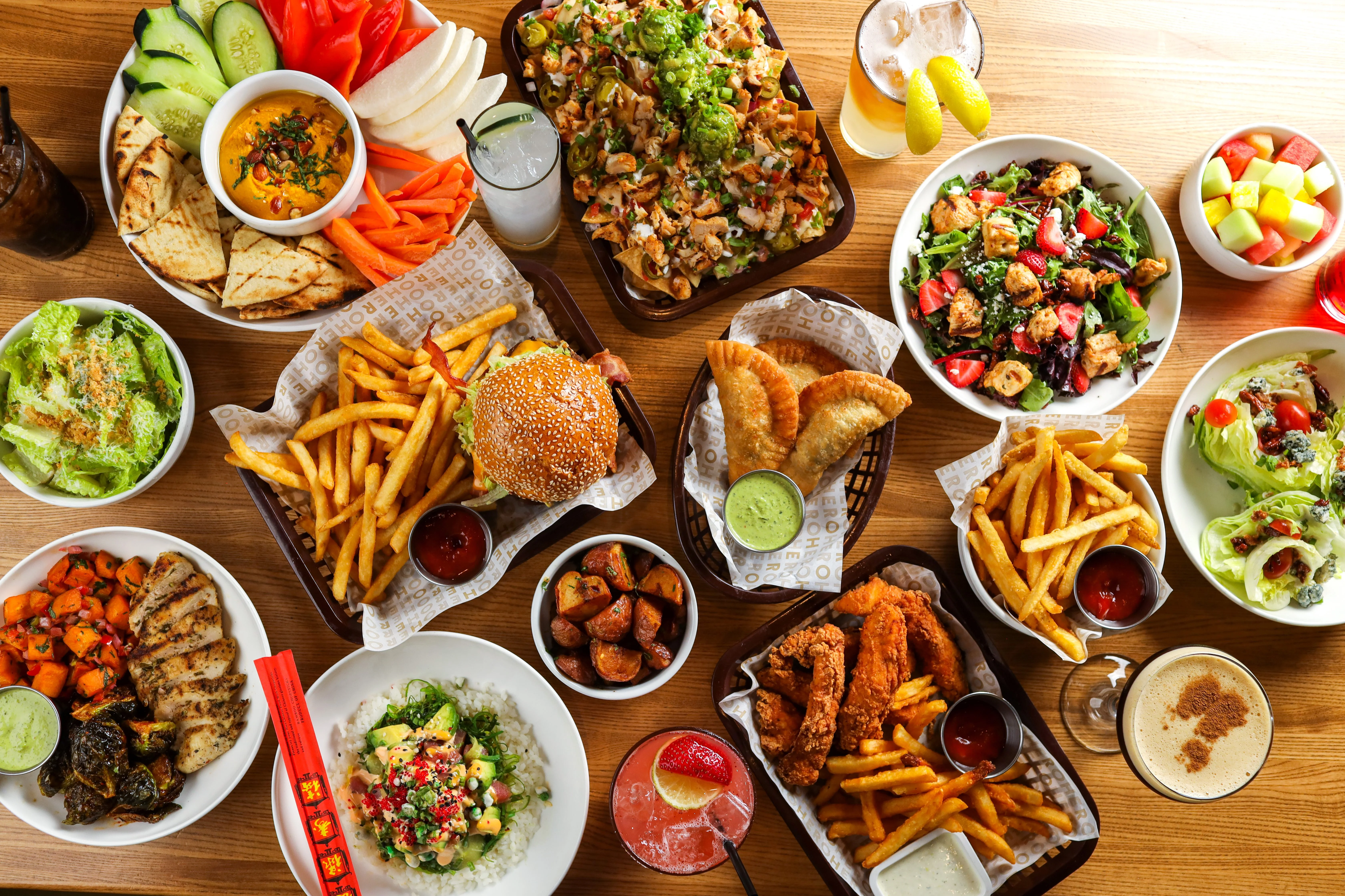 Assorted global dishes including burgers, salads, and appetizers