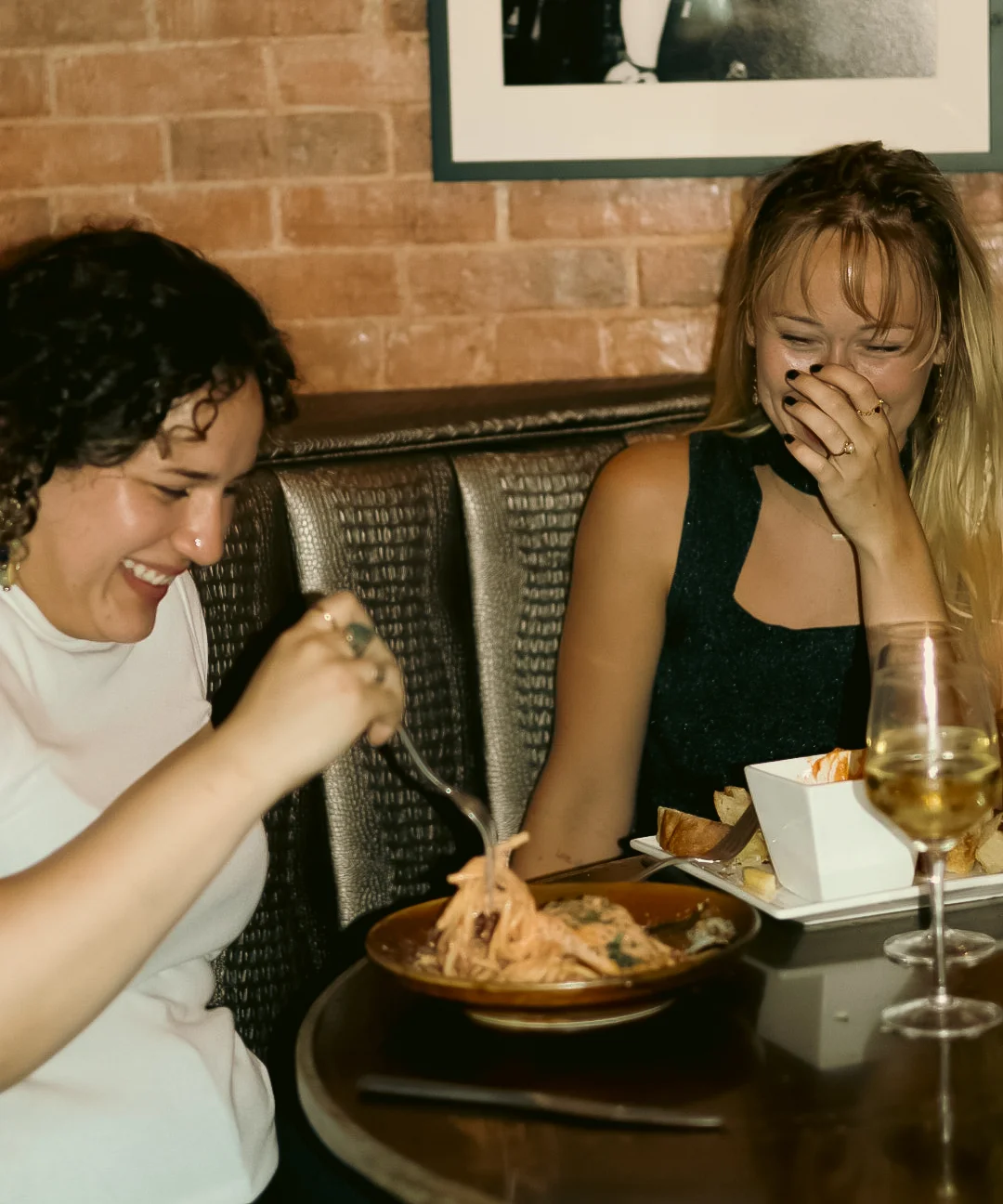 Two friends enjoying dinner in Fleetwood's Vault